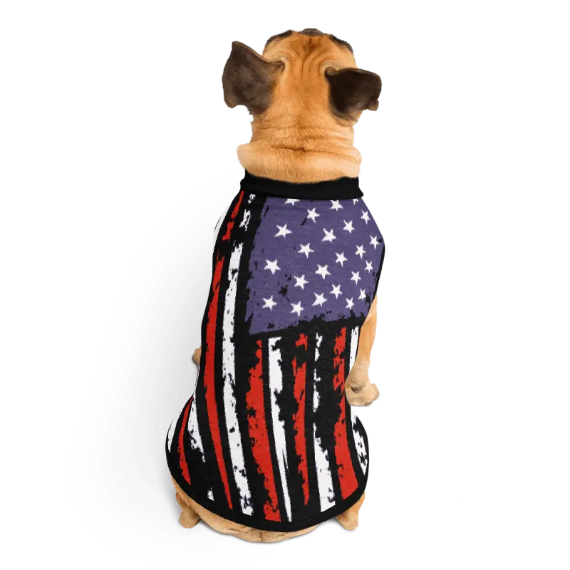 Dog wearing an American flag-themed pet outfit on a white background
