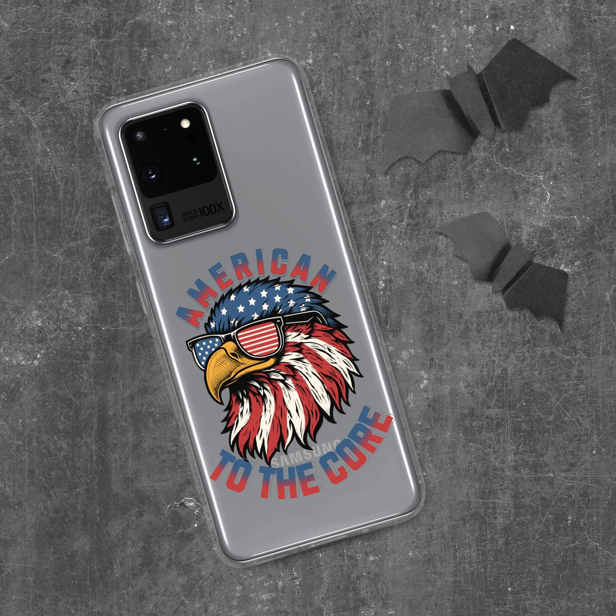 A patriotic Samsung phone clear case with an eagle head and the text "American To The Core."