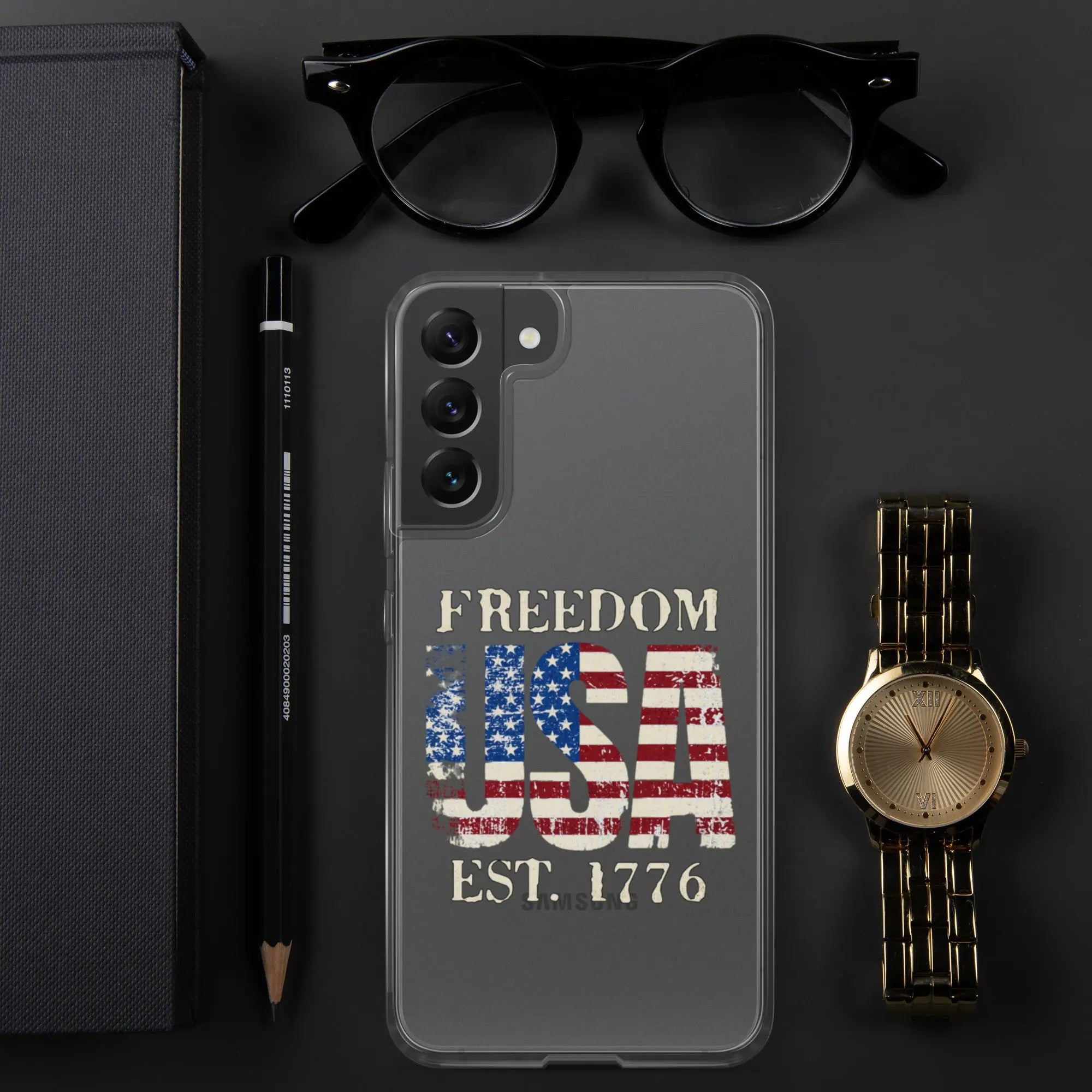 A patriotic Samsung clear phone case with the American flag in the shape of the USA and the text "Freedom est. 1776."