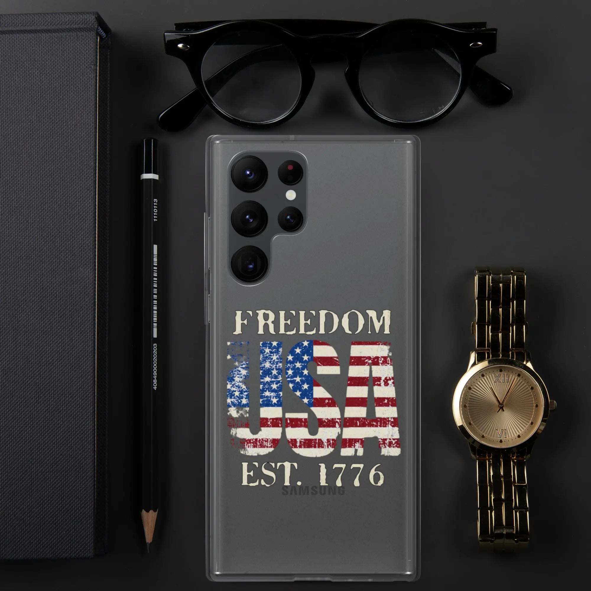 A patriotic Samsung clear phone case with the American flag in the shape of the USA and the text "Freedom est. 1776."