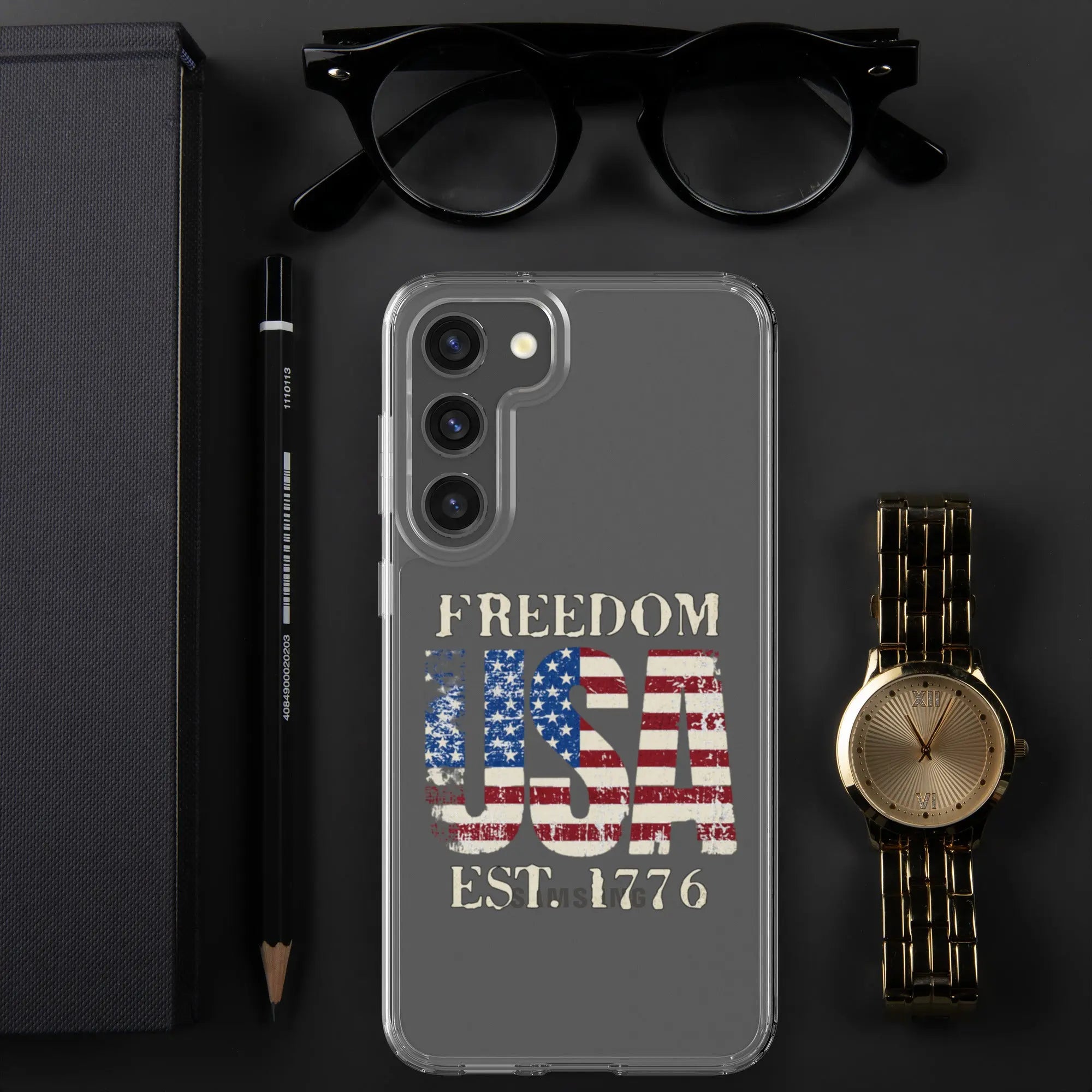 A patriotic Samsung clear phone case with the American flag in the shape of the USA and the text "Freedom est. 1776."