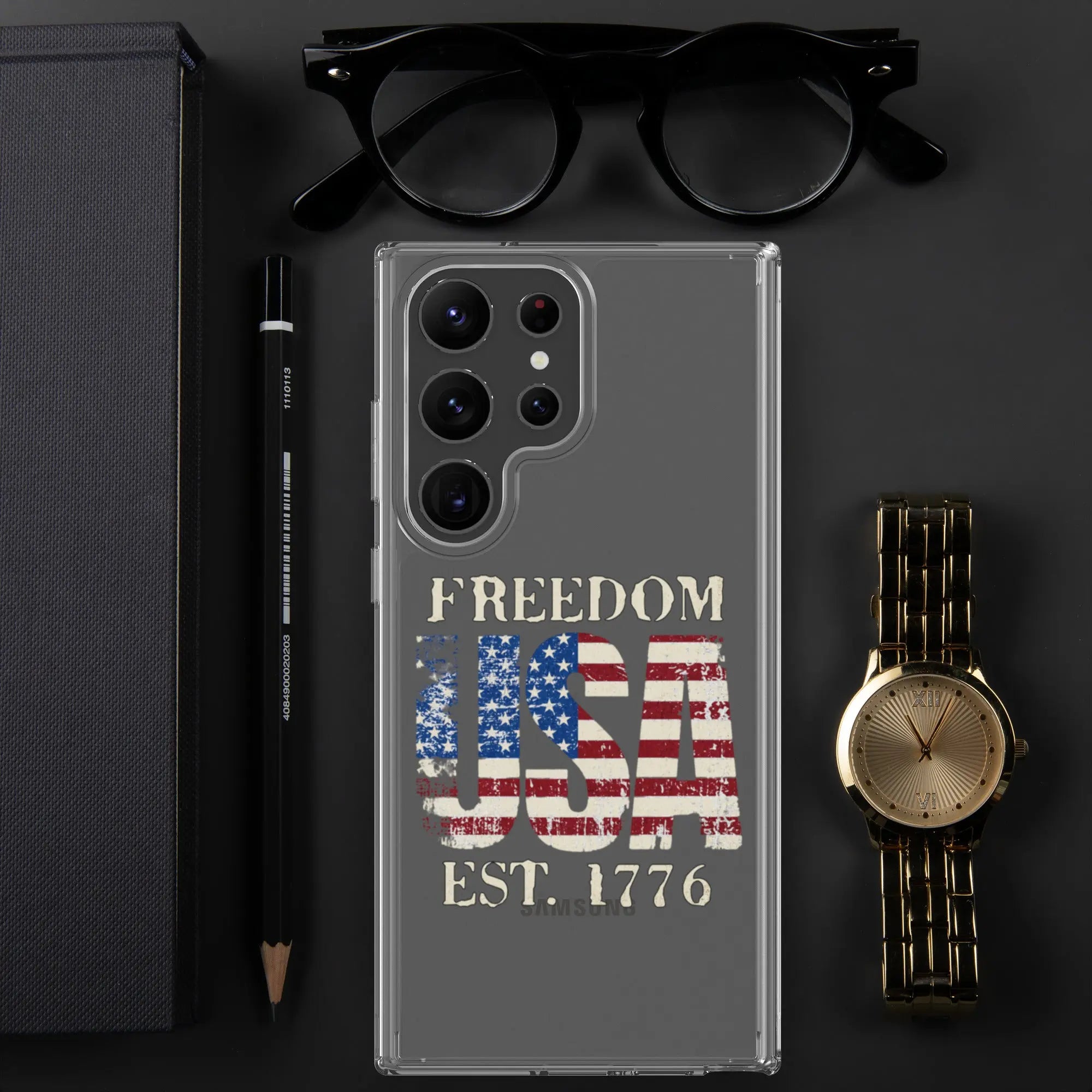 A patriotic Samsung clear phone case with the American flag in the shape of the USA and the text "Freedom est. 1776."