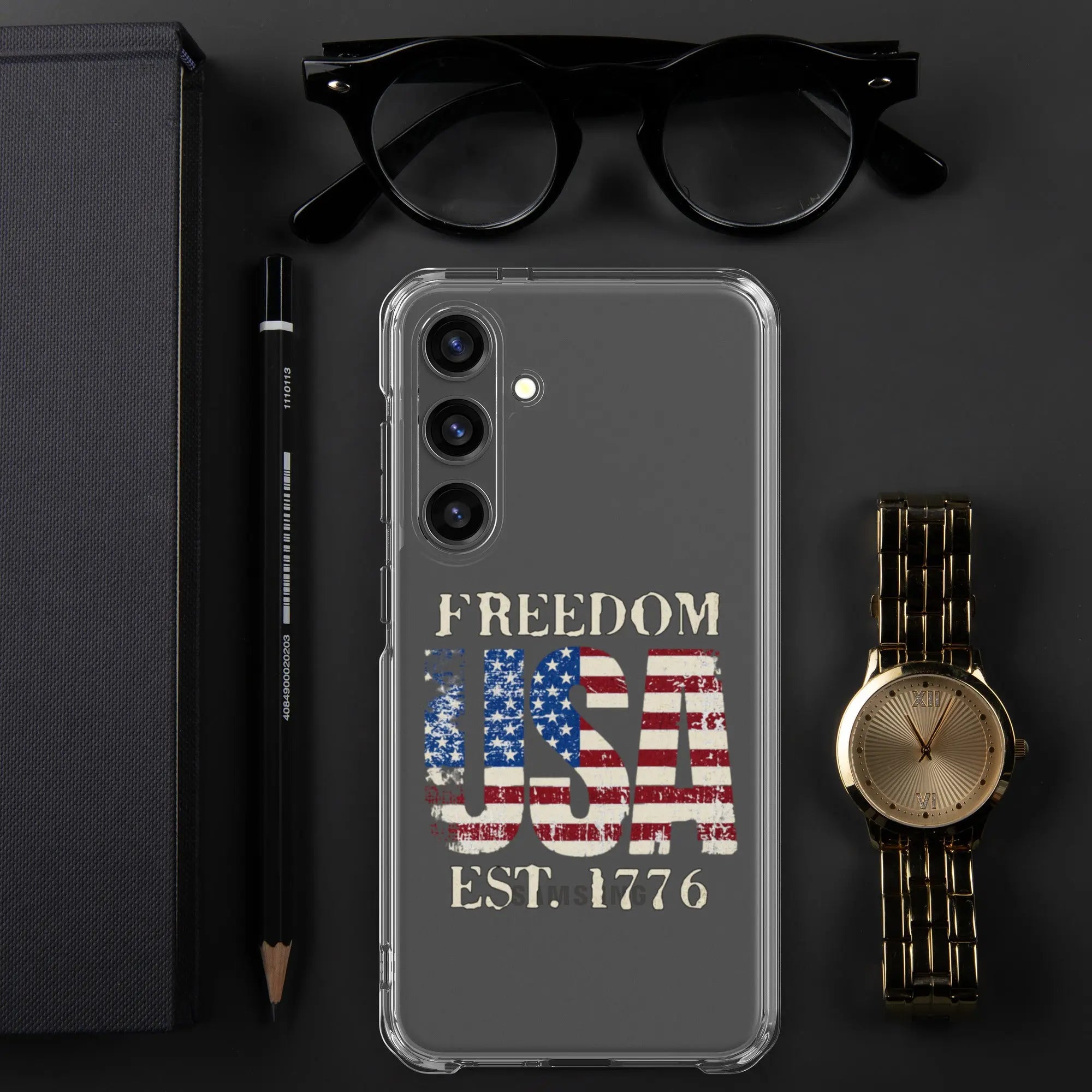 A patriotic Samsung clear phone case with the American flag in the shape of the USA and the text "Freedom est. 1776."