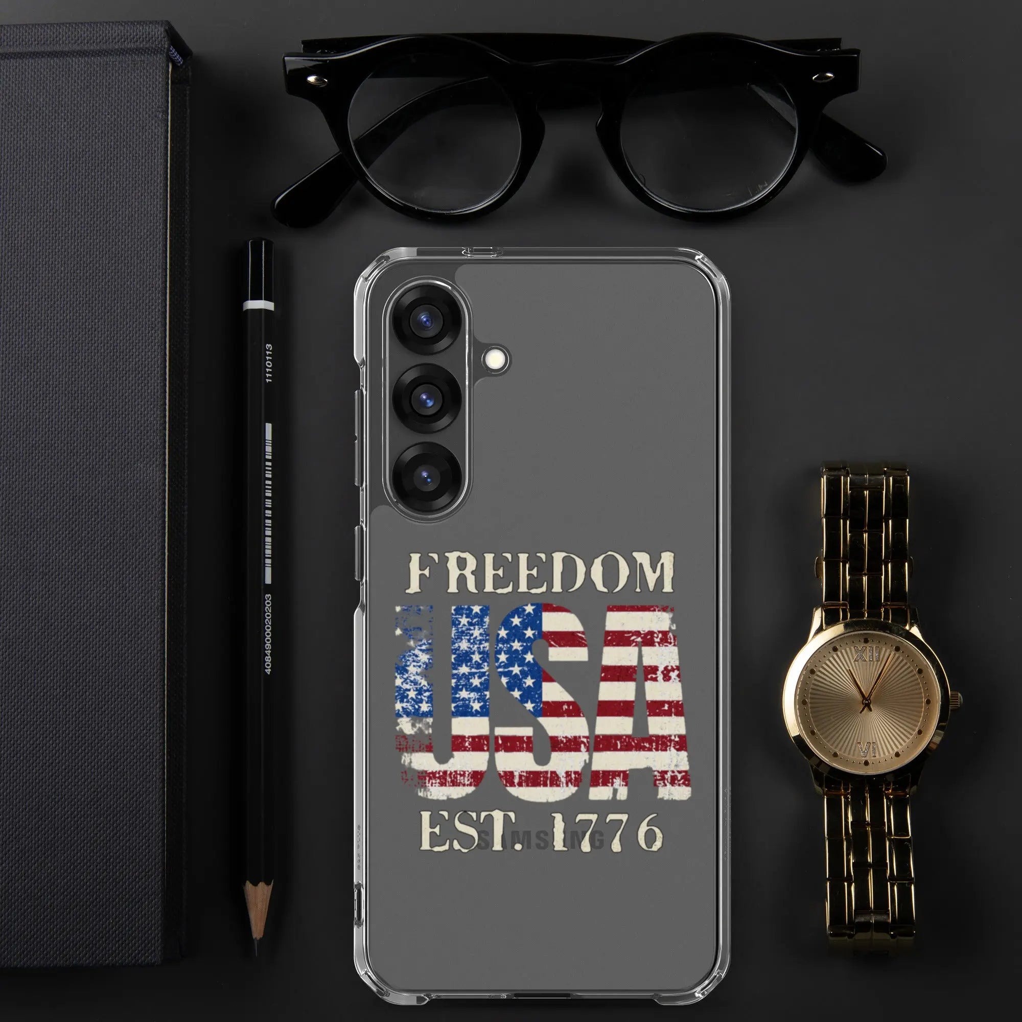 A patriotic Samsung clear phone case with the American flag in the shape of the USA and the text "Freedom est. 1776."