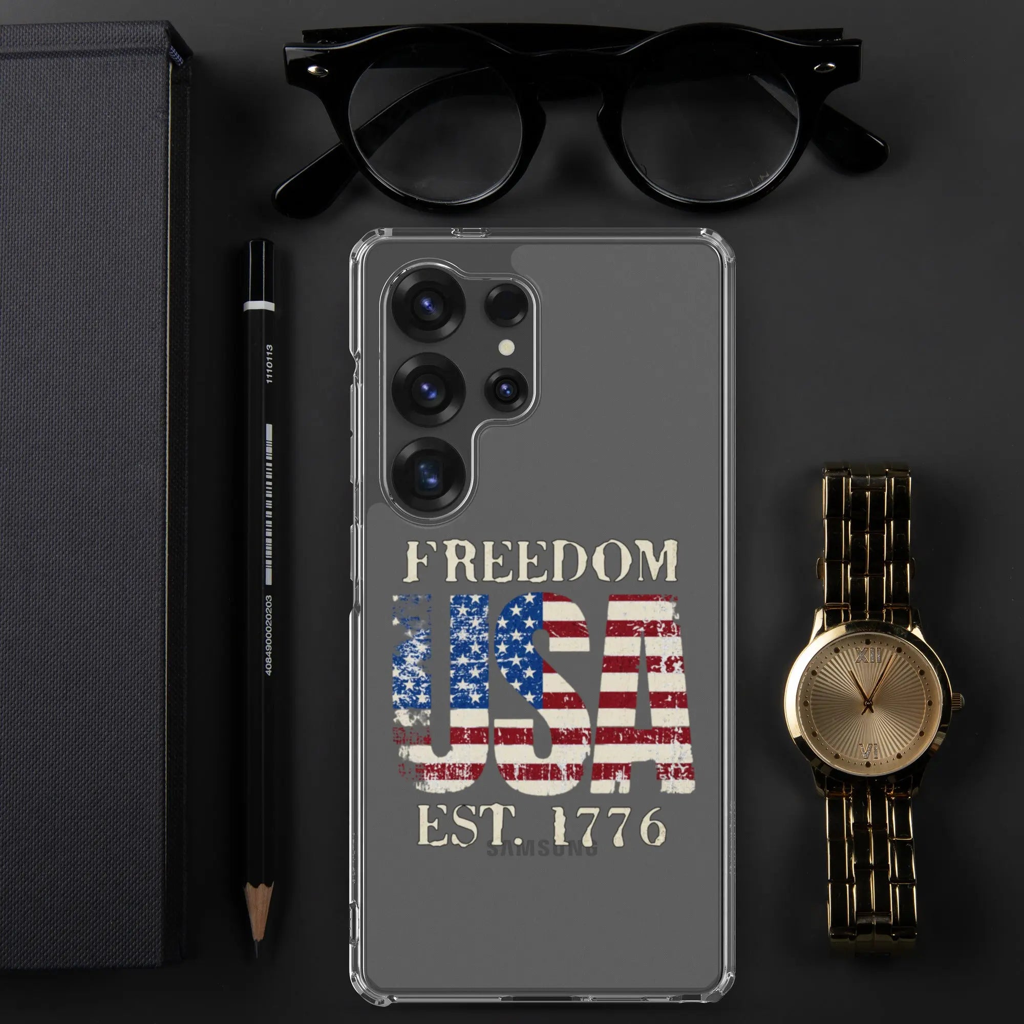A patriotic Samsung clear phone case with the American flag in the shape of the USA and the text "Freedom est. 1776."