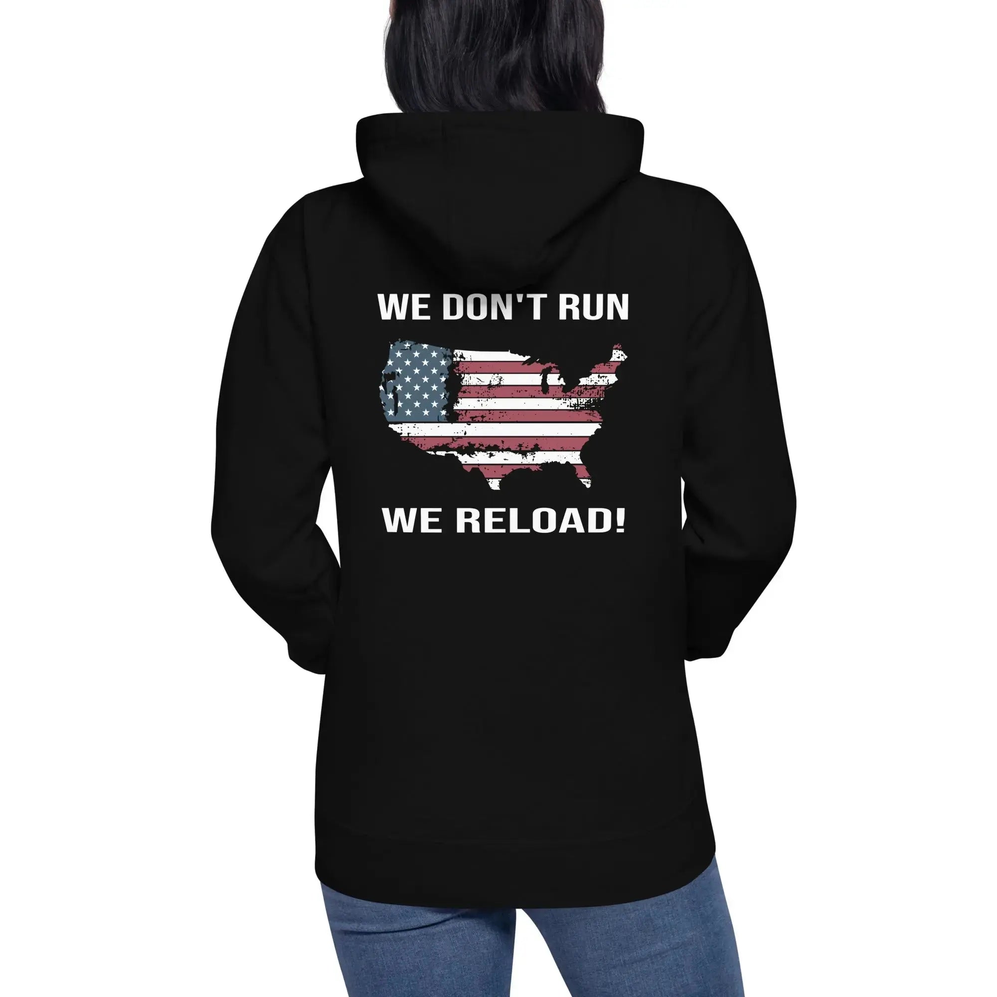 Back of a woman wearing a black patriotic hoodie with the silhouette of America with the flag on it. And the text "We Don't Run, We Reload.   