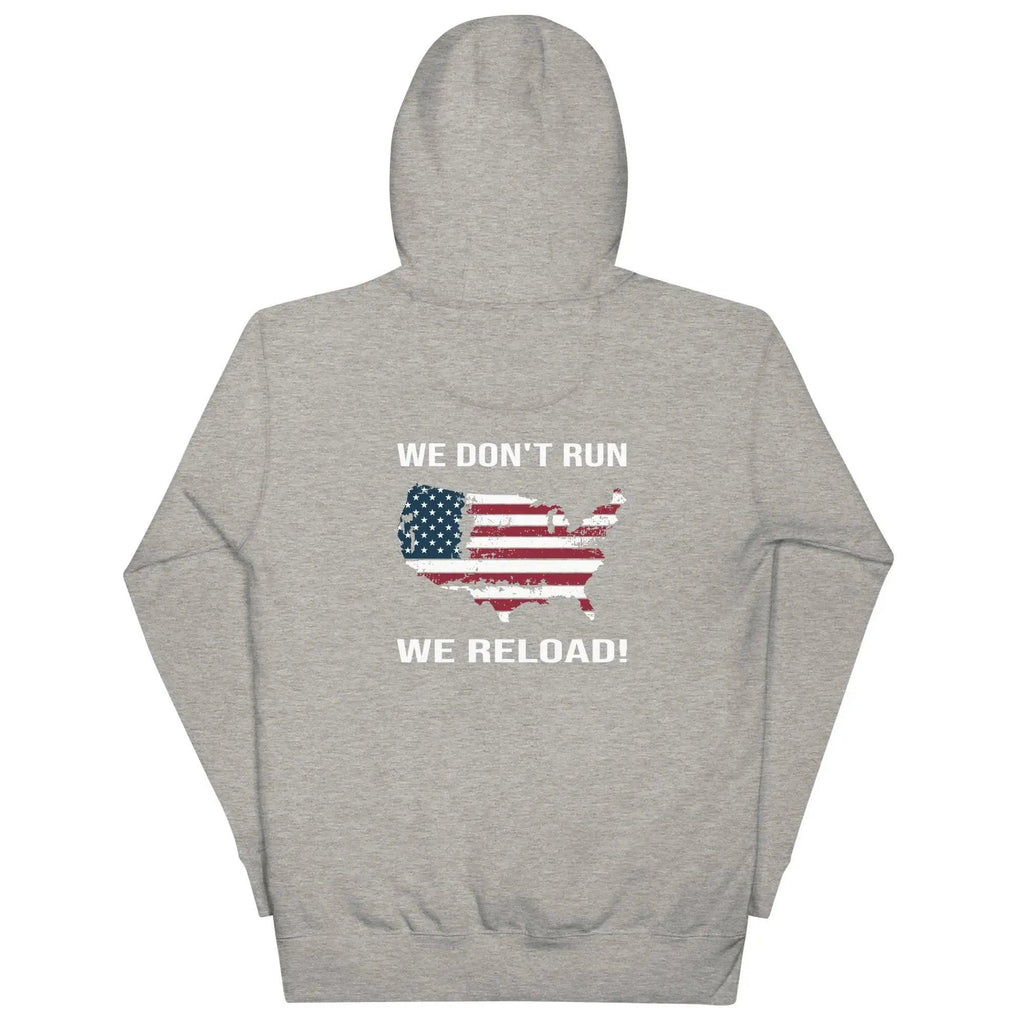 Back of a women's carbon grey patriotic hoodie with the silhouette of America with the flag on it. And the text "We Don't Run, We Reload." 