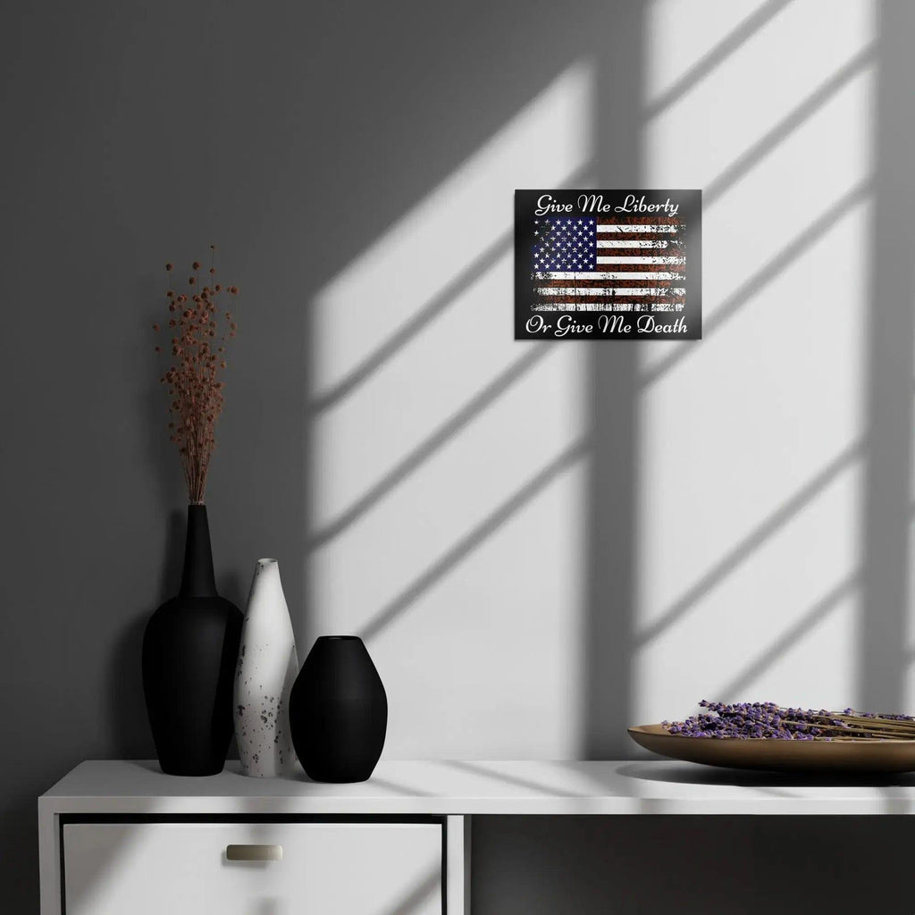 A patriotic metal sign hangs on the wall with the American flag and the text "Give Me Liberty or Give Me Death."