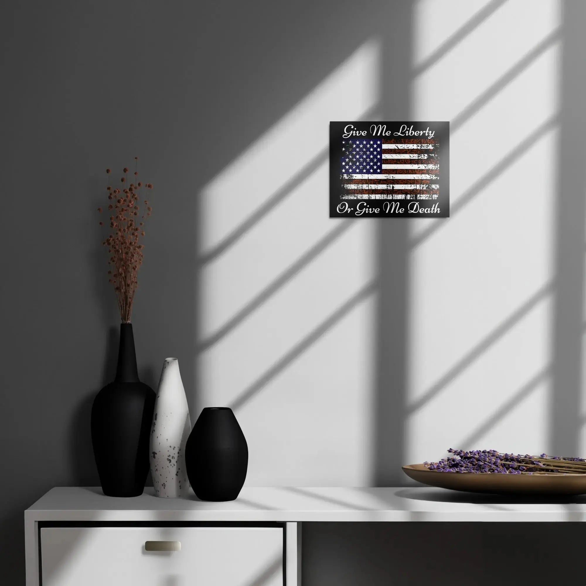 A patriotic metal sign hangs on the wall with the American flag and the text "Give Me Liberty or Give Me Death."