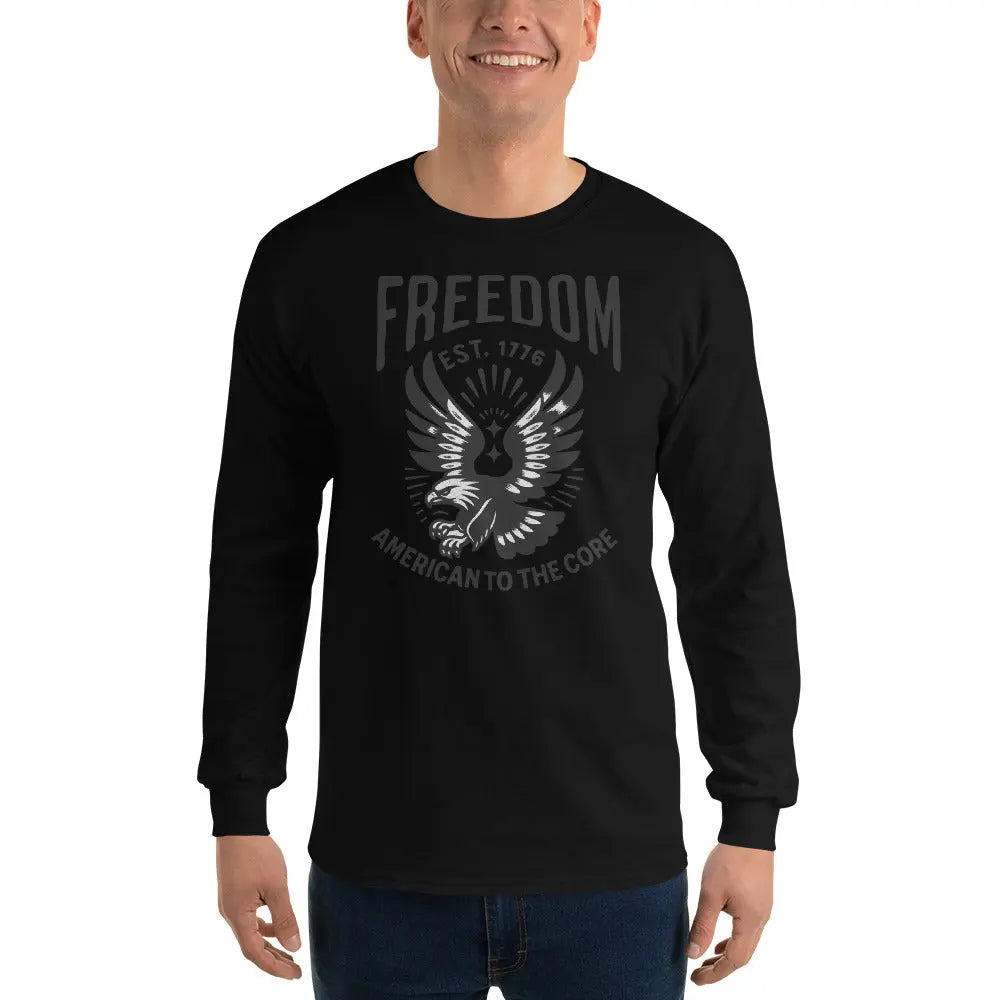 A man wearing a patriotic black long-sleeved shirt with a flying eagle and the text "Freedom est. 1776 and American To The Core."