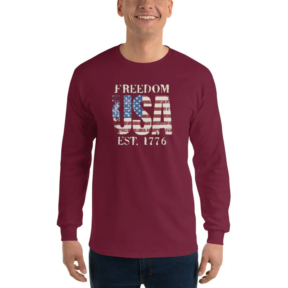 A man wearing a patriotic maroon long-sleeved shirt with the American flag in the shape of USA and the text "Freedom est. 1776."