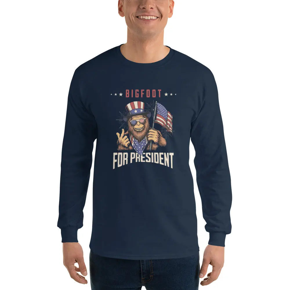 A man wearing a patriotic navy blue long-sleeved shirt with Bigfoot holding an American flag and the text "Bigfoot for president."
