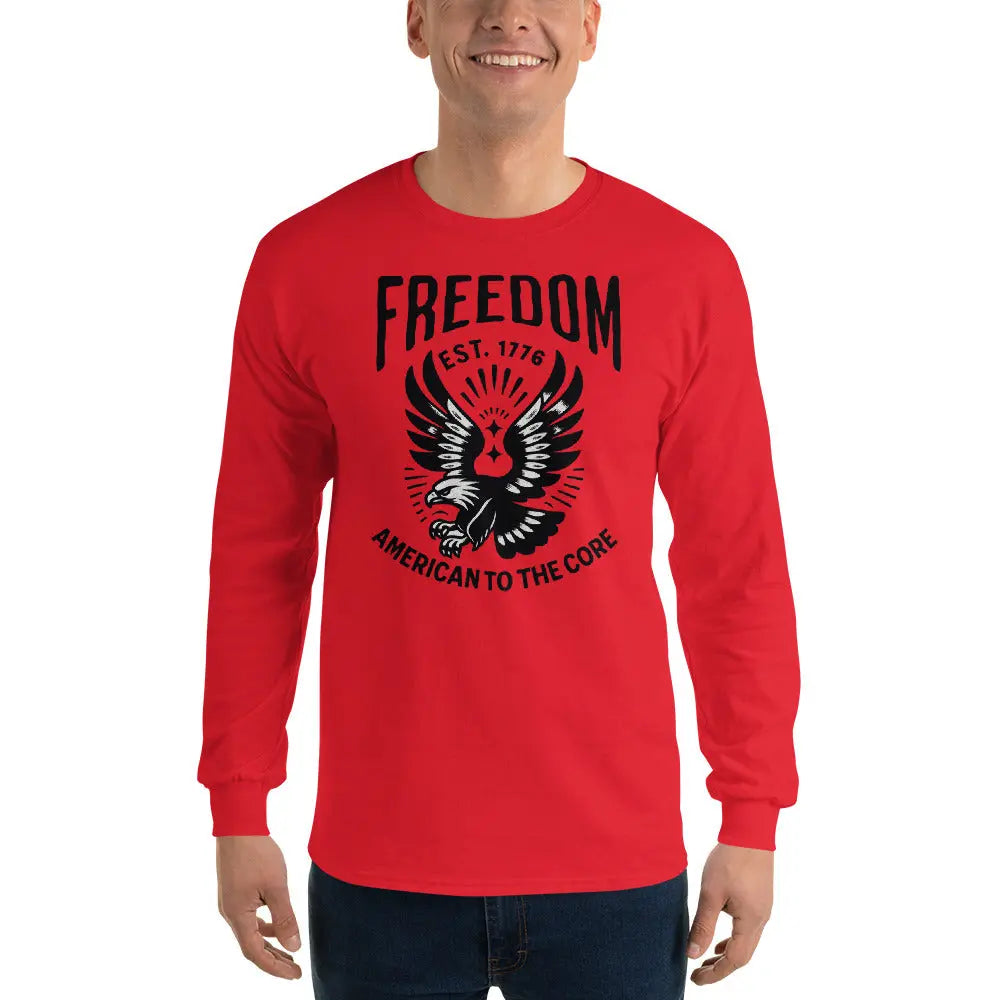 A man wearing a patriotic red long-sleeved shirt with a flying eagle and the text "Freedom est. 1776 and American To The Core."