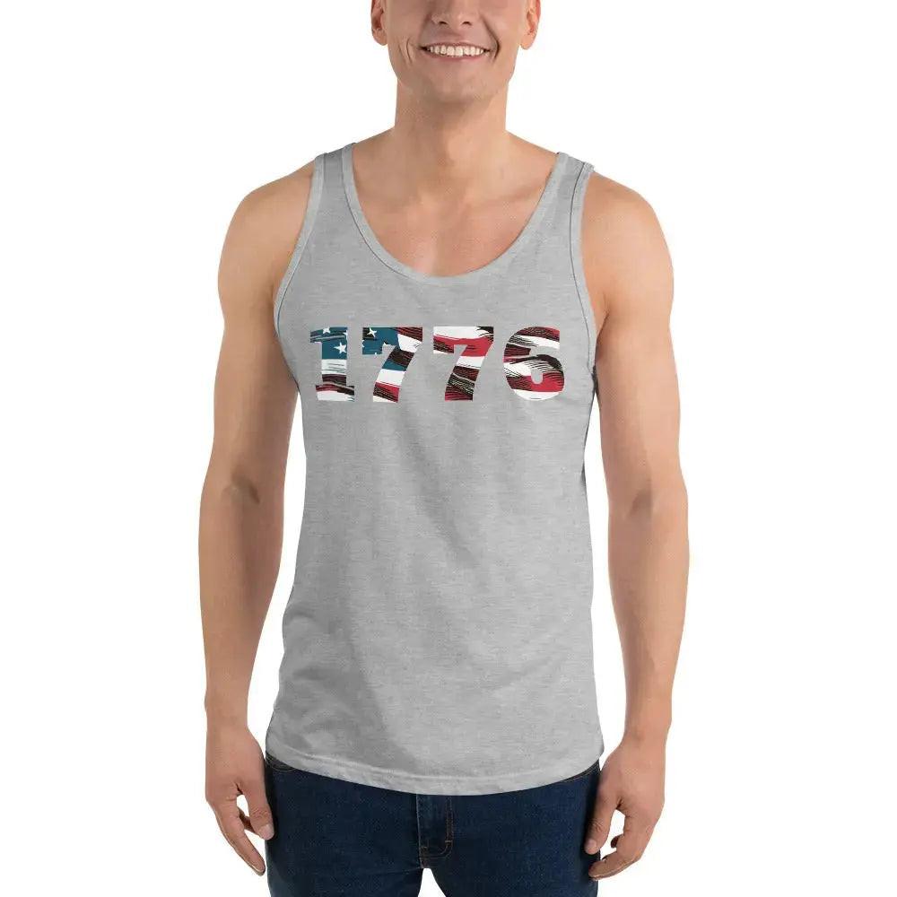 A man wearing a athletic heather patriotic tank top with the American flag in the shape of 1776. 