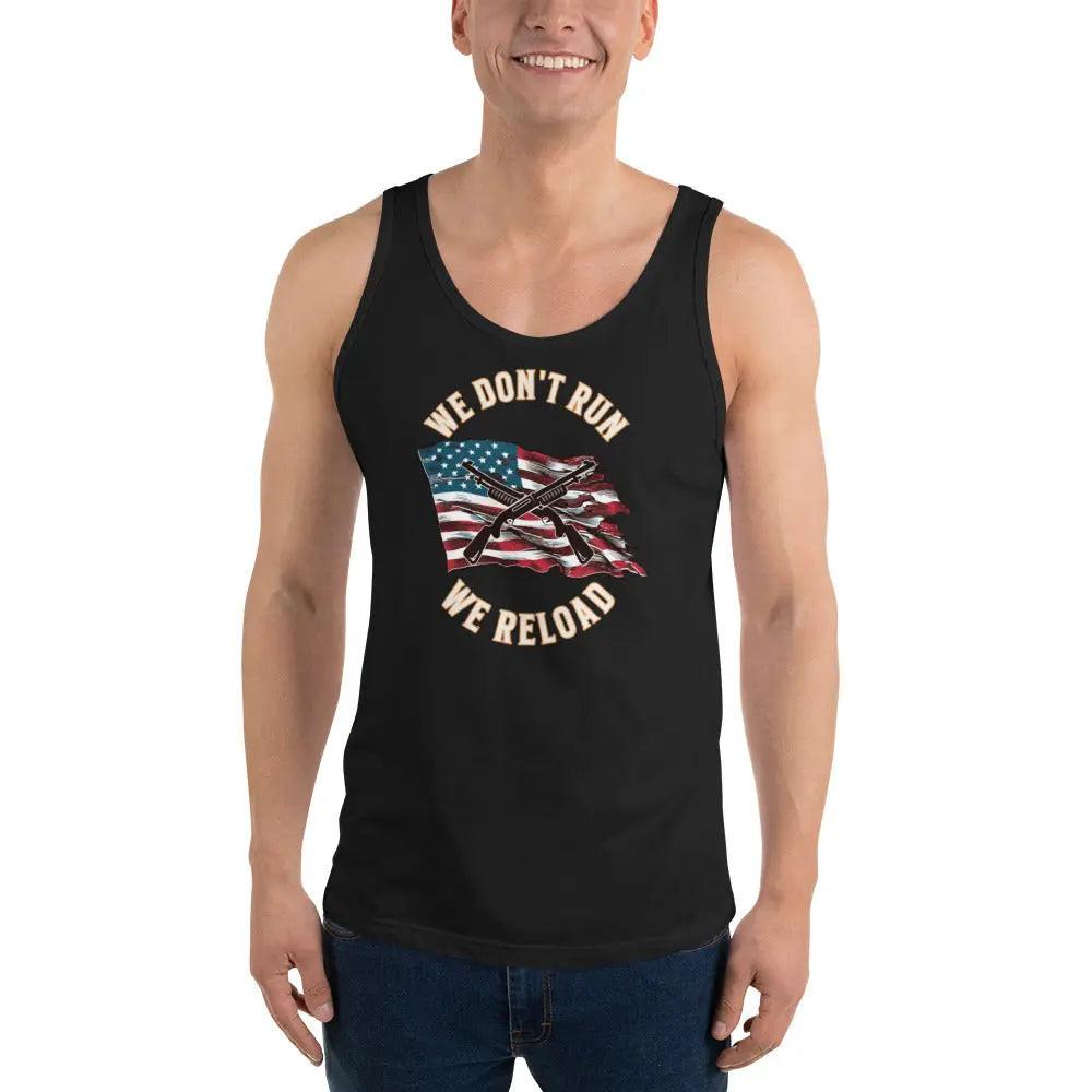 A man wearing a black patriotic tank top with a pair of shotguns over the American flag and the text "We don't run; we reload."
