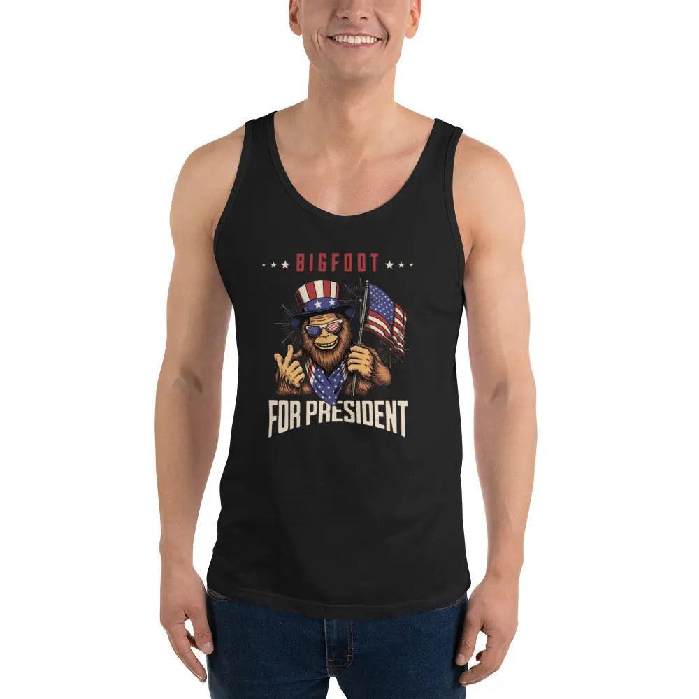 A man wearing a black patriotic tank top with Bigfoot holding the American flag with the text "Bigfoot For President."