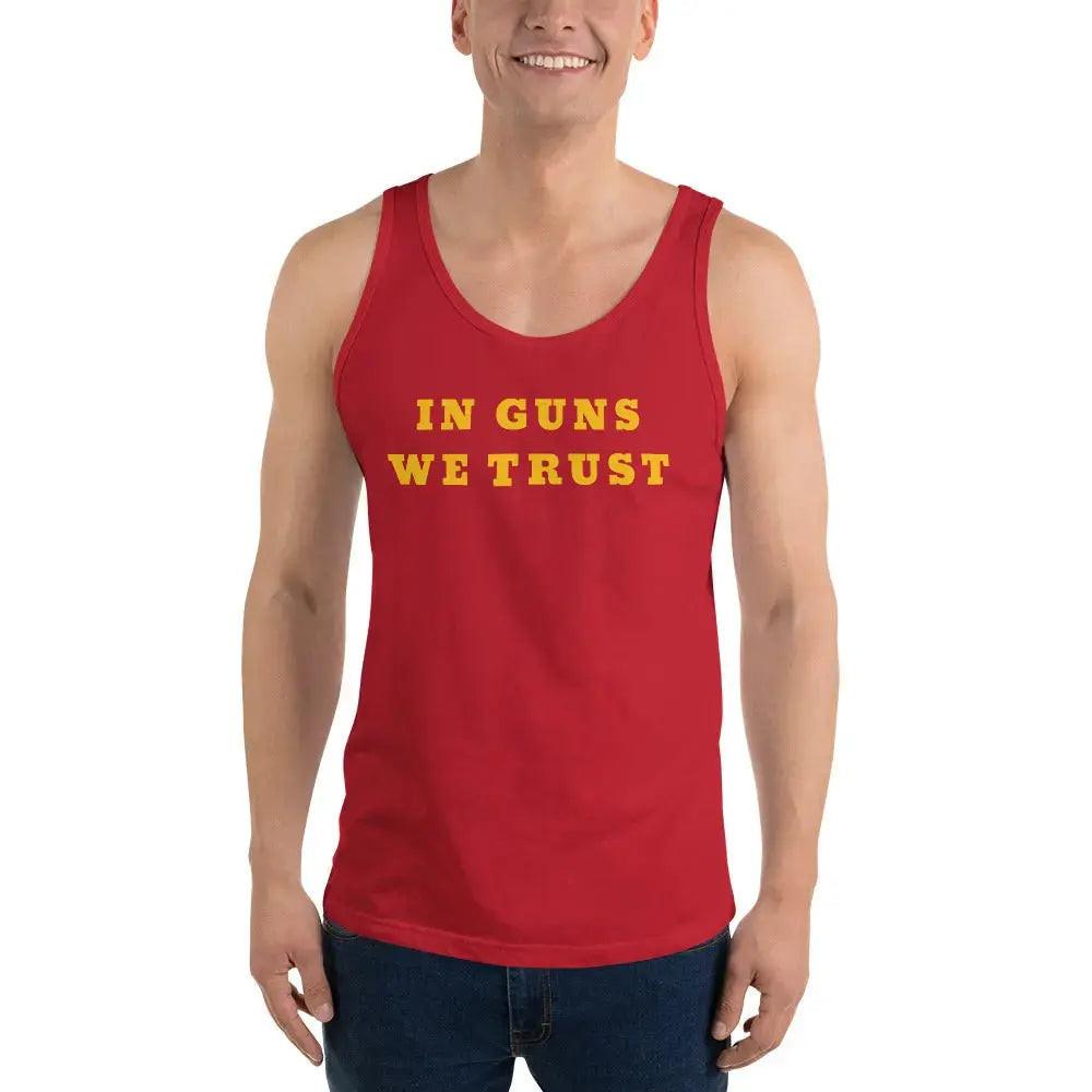 A man wearing a red patriotic tank top with the text "In Guns We Trust." 