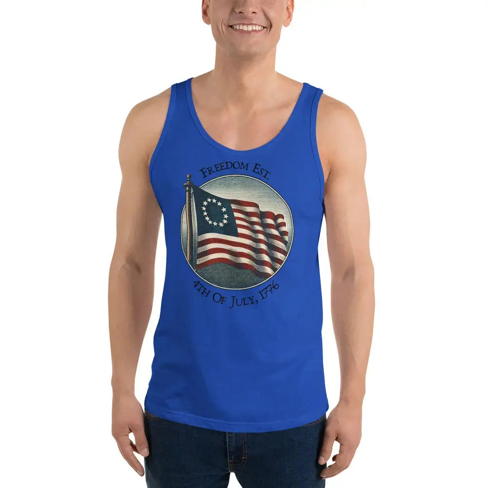 A man wearing a royal blue patriotic tank top with the American flag and the text "Freedom Est. 4th of July, 1776."