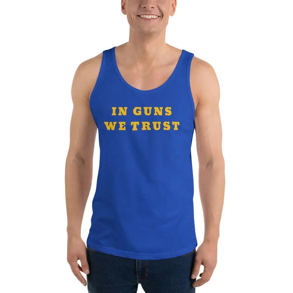 A man wearing a royal blue patriotic tank top with the text "In Guns We Trust." 