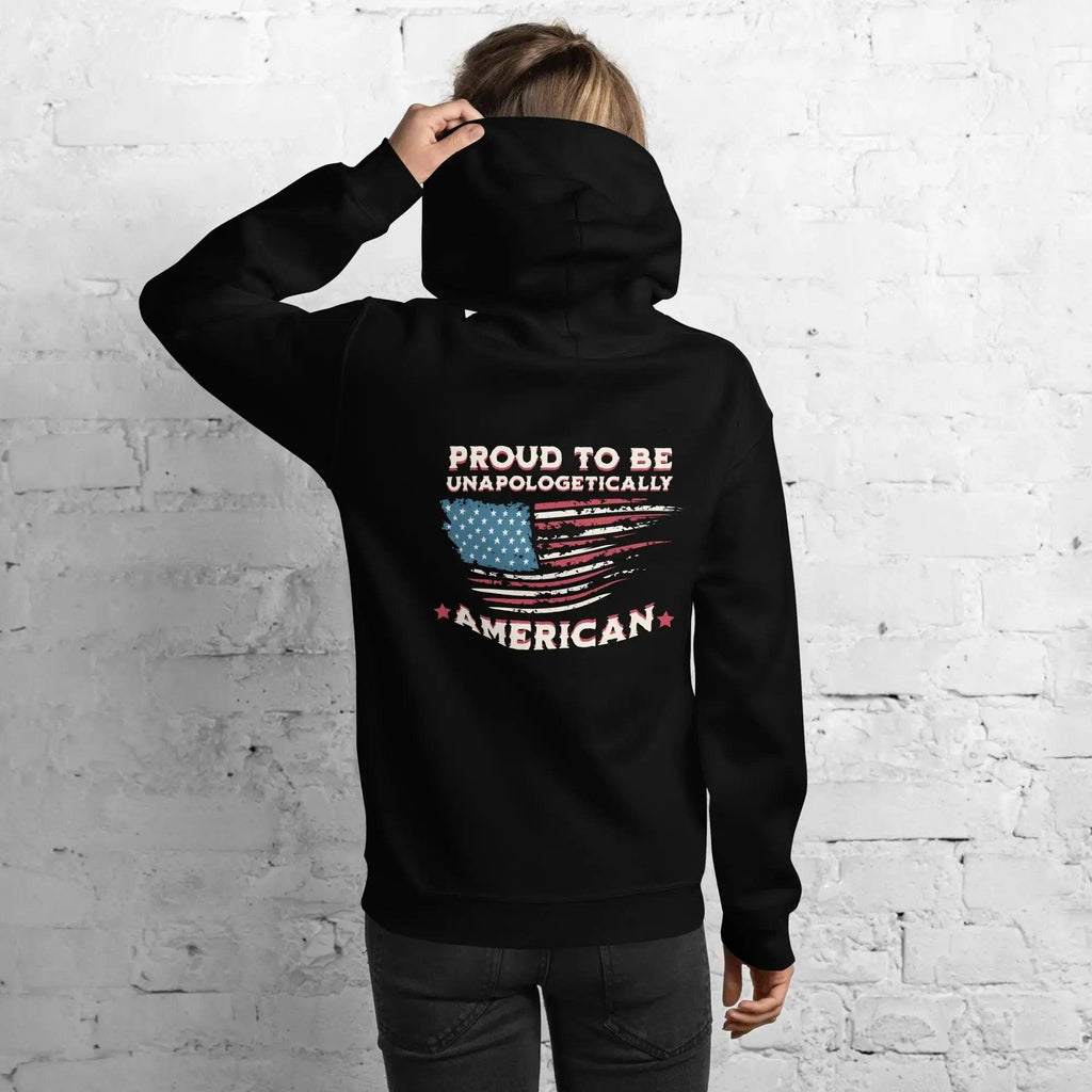 Back of a woman wearing a black, patriotic hoodie with the American flag and the text "Proud to be unapologetically American."