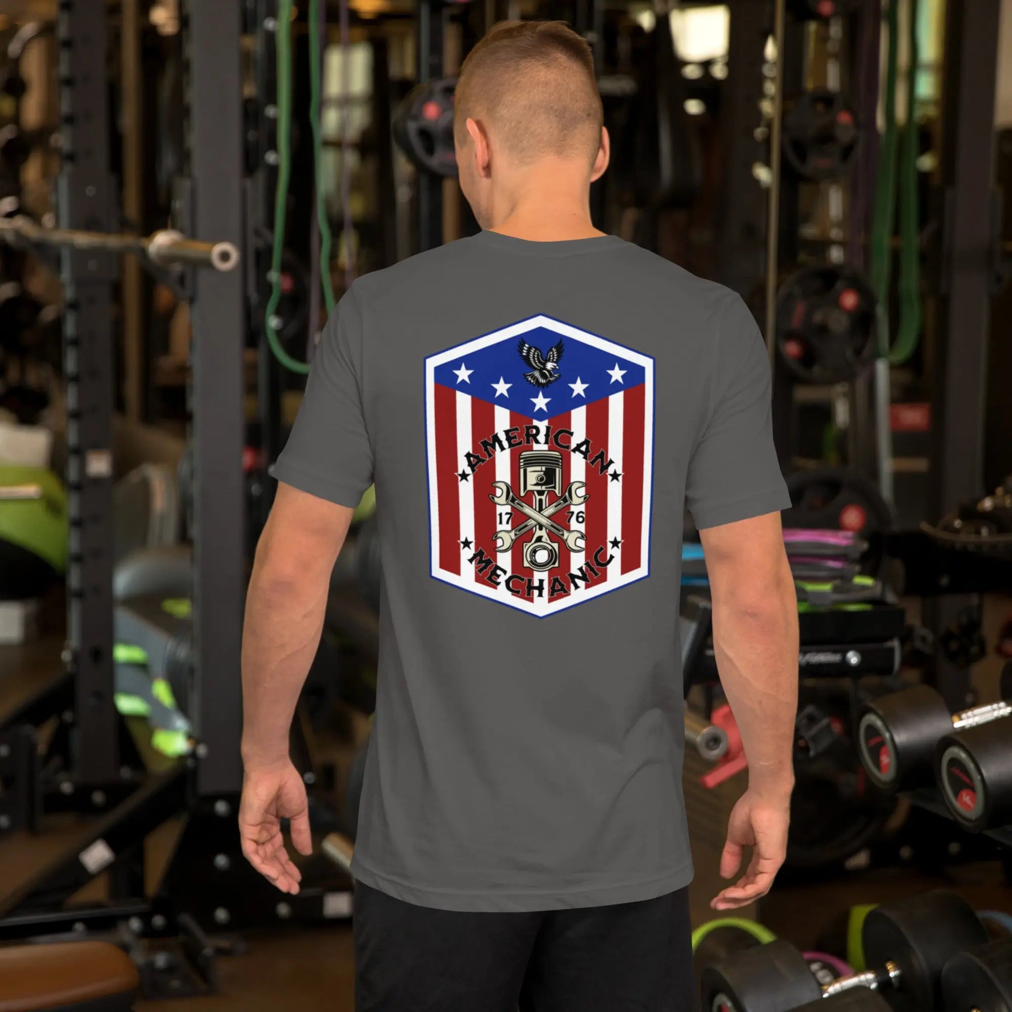 Back of man wearing an asphalt  patriotic t-shirt with "American Mechanic" text