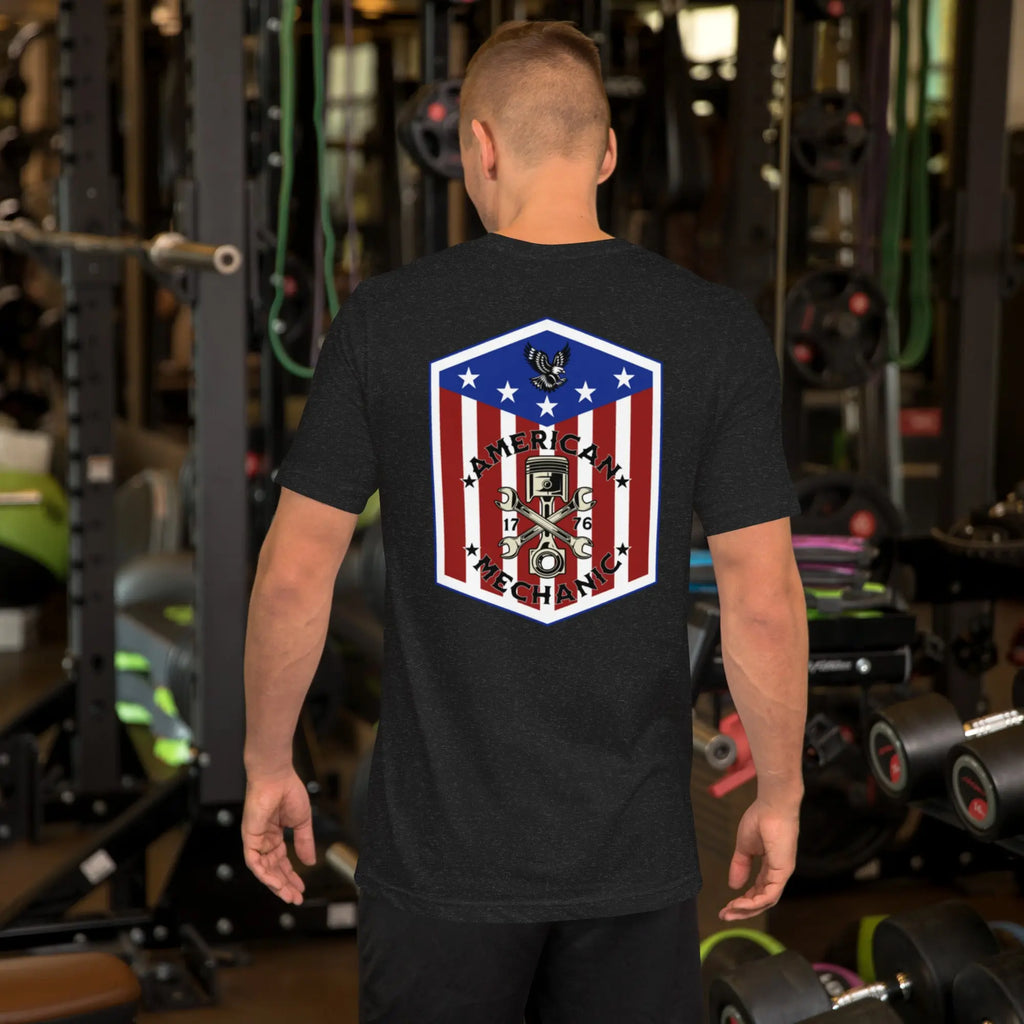 Back of man wearing a black heather patriotic t-shirt with "American Mechanic" text