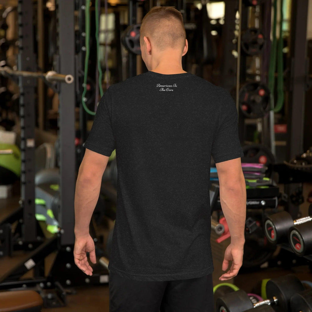 Back of a man wearing a black heather patriotic t-shirt with the text "American To The Core."