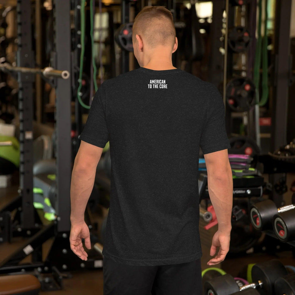 Back of a man wearing a black heather patriotic t-shirt with the text "American To The Core."