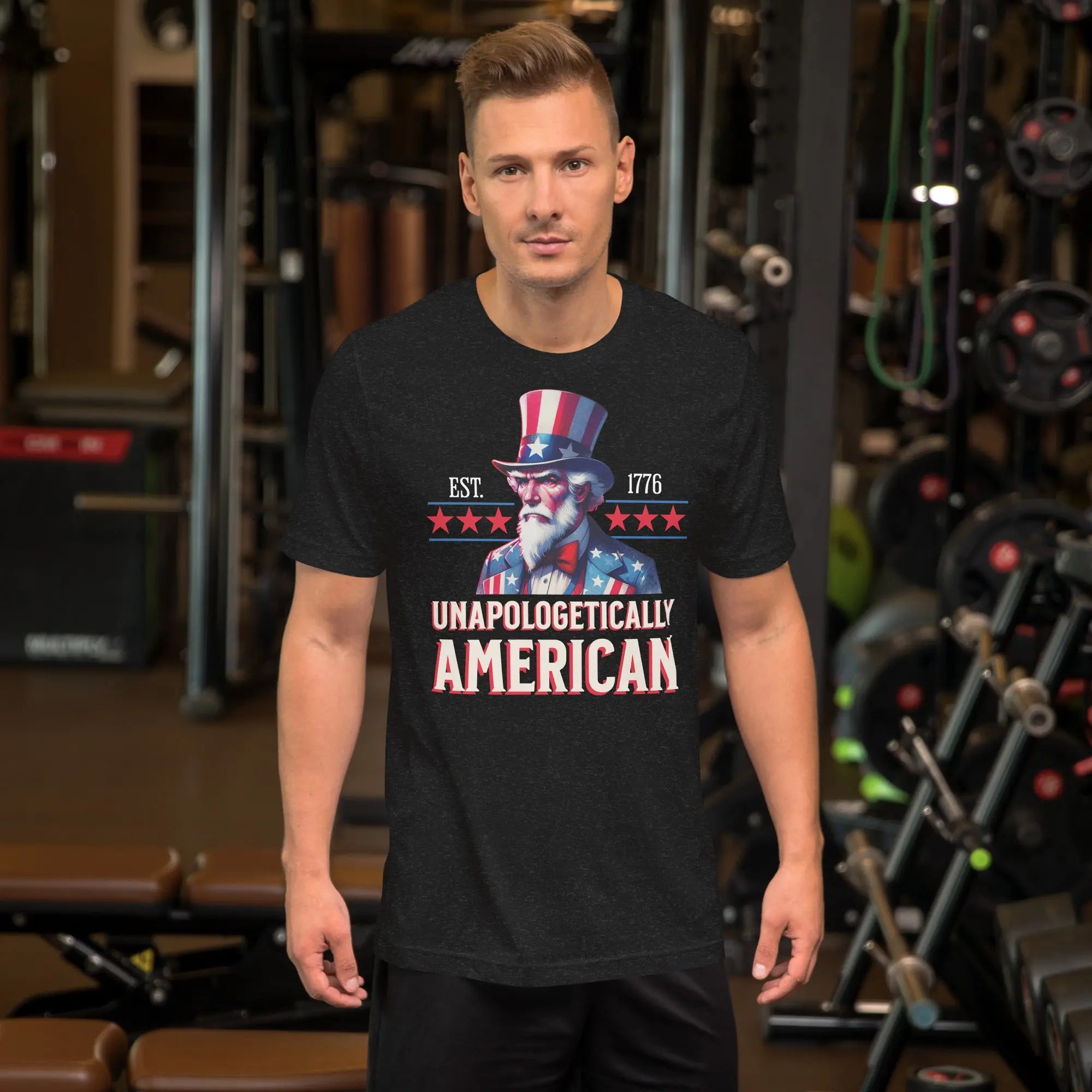 Man wearing a black t-shirt with a patriotic design in a gym setting