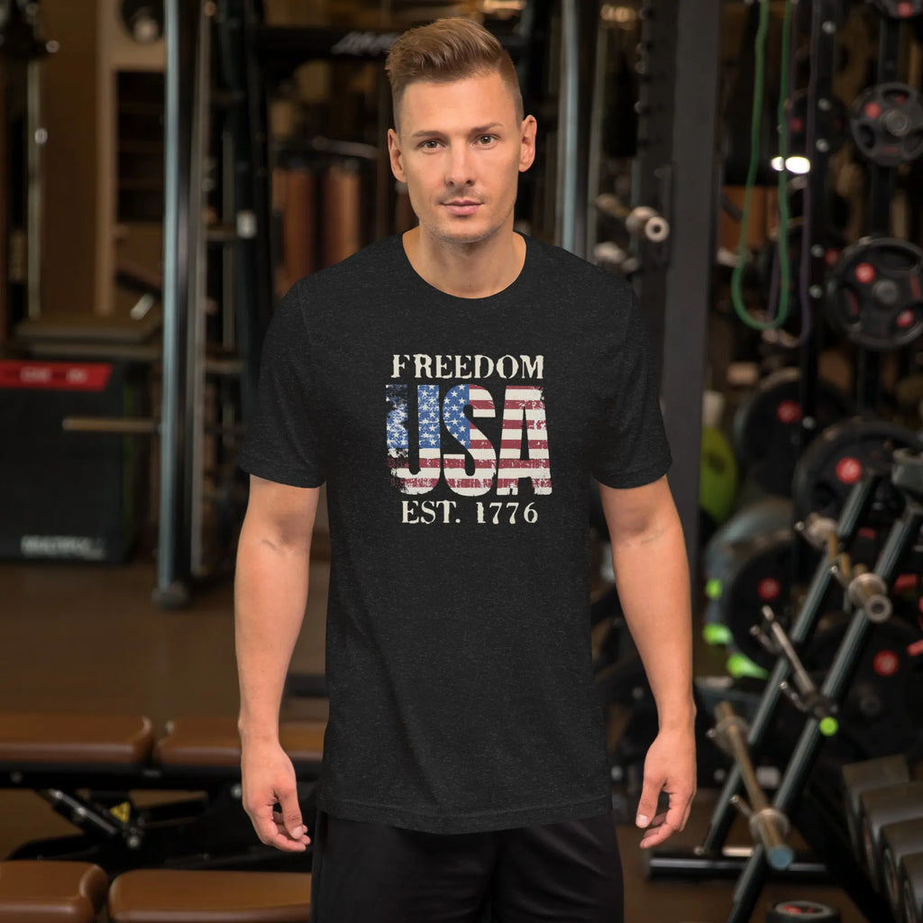 a man wearing a black patriotic t-shirt with "Freedom USA Est. 1776" text.