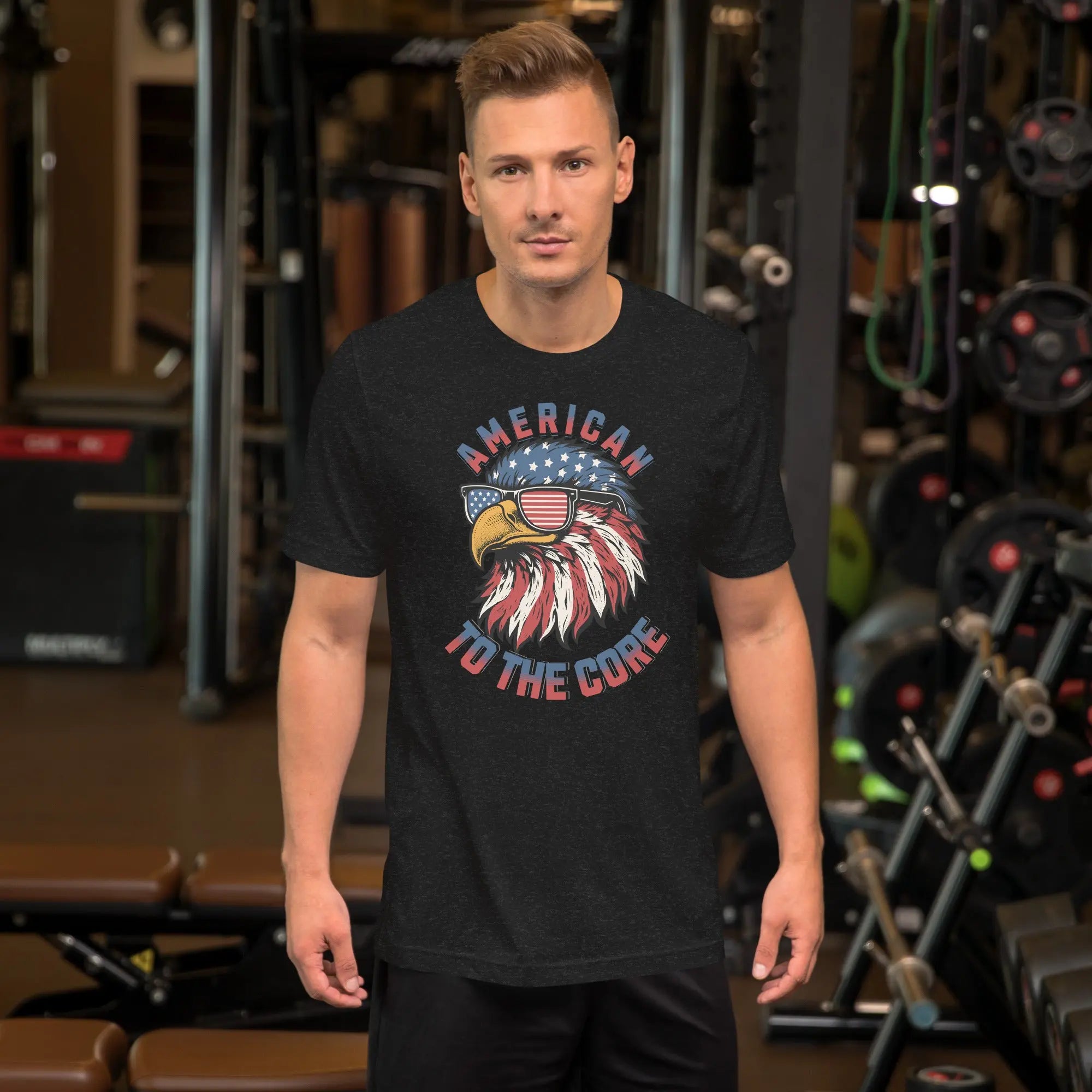 man wearing a black patriotic t-shirt with a eagle head with "American to the core" text.