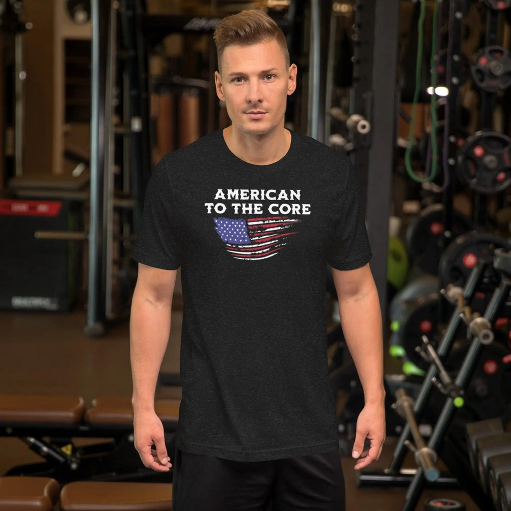 Man wearing a black heather patriotic t-shirt with the American flag and the text "American To The Core."