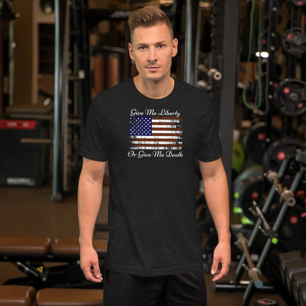 A man wearing a black heather patriotic t-shirt with the American flag and the text "Give me liberty or give me death."