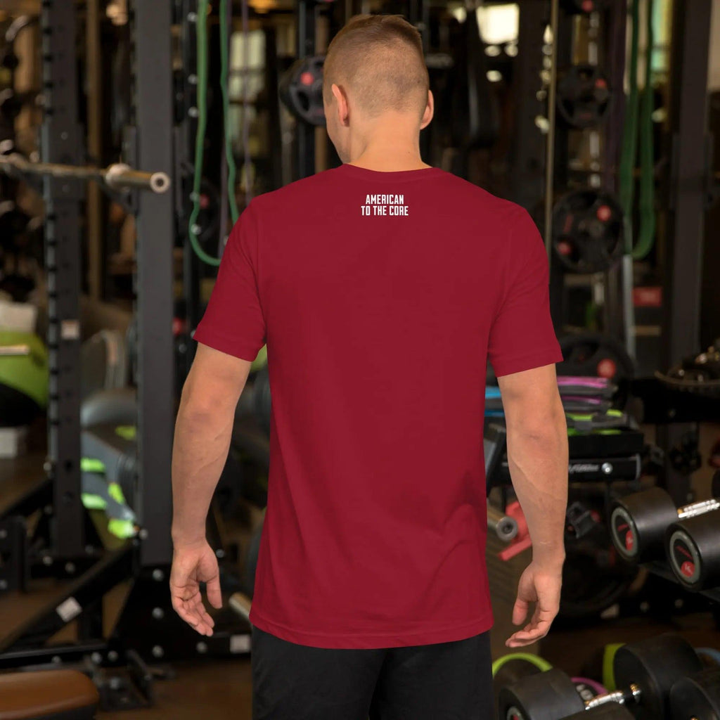 Back of a man wearing a cardinal red patriotic t-shirt with the text "American To The Core."