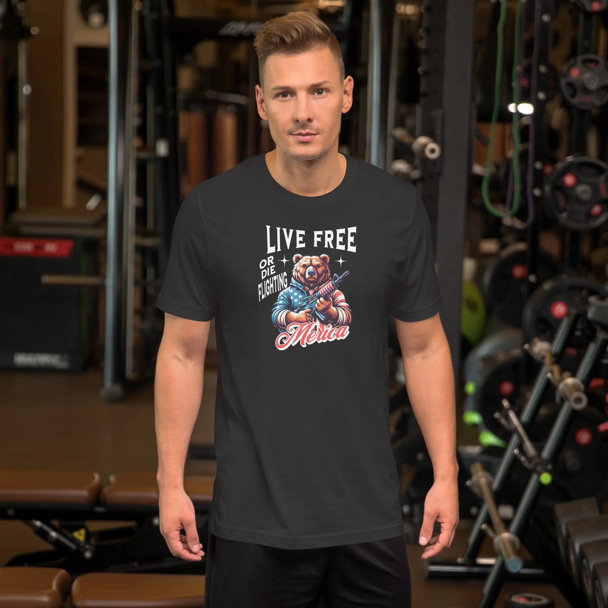 man wearing a dark grey patriotic t-shirt with a image of a bear holding a gun with "live free or die fighting Merica" text