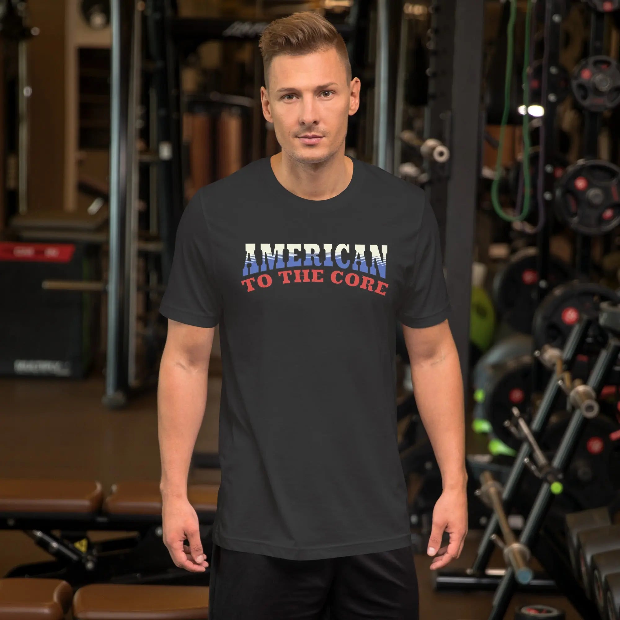 A man wearing a dark grey patriotic t-shirt with "America to the core" text in red, white and blue