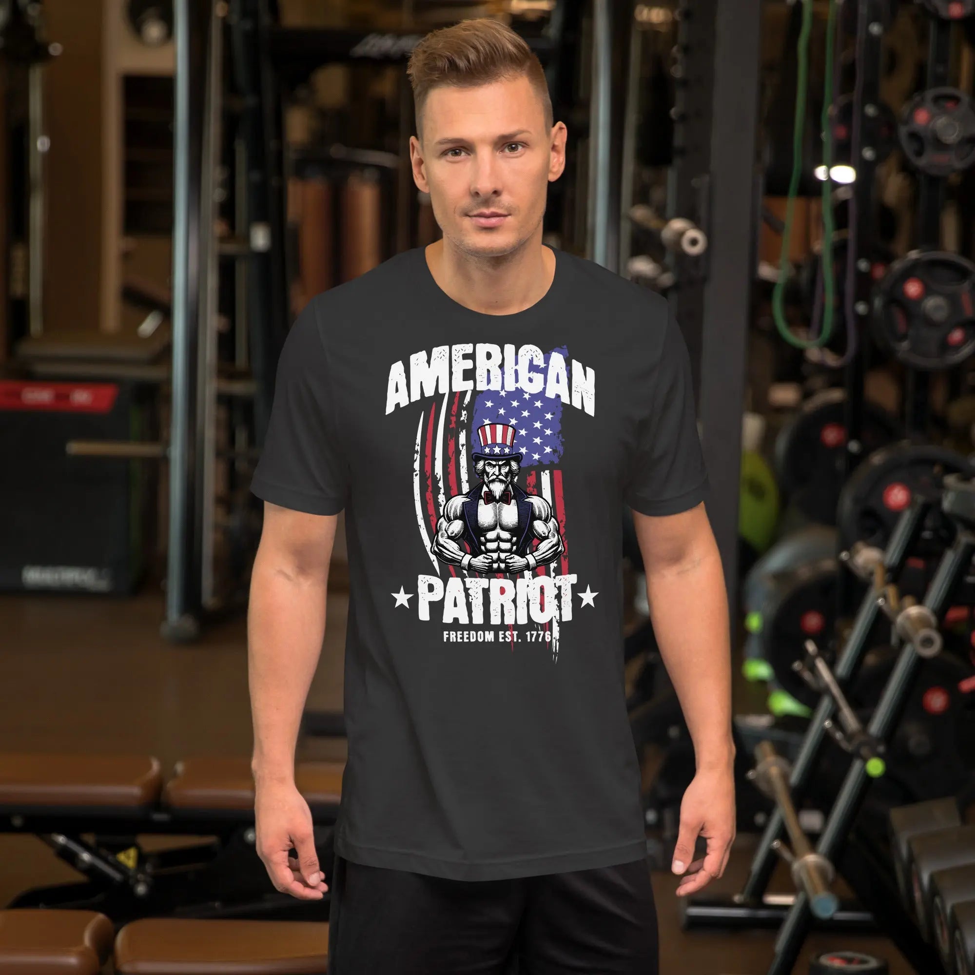 A man wearing a dark grey patriotic t-shirt with a muscular Uncle Sam with "American Patriot" text.