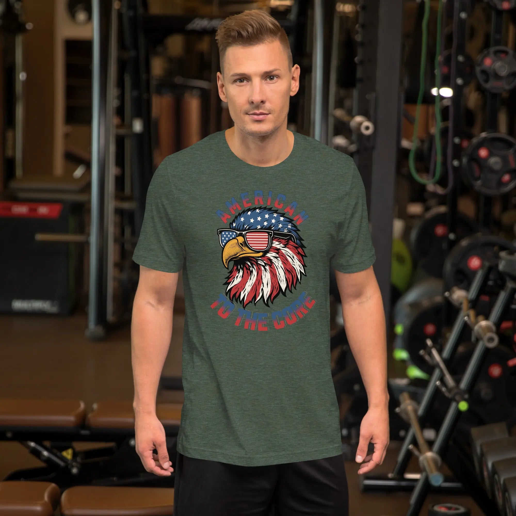 A man wearing a green patriotic t-shirt with an eagle head with "American to the core" text.
