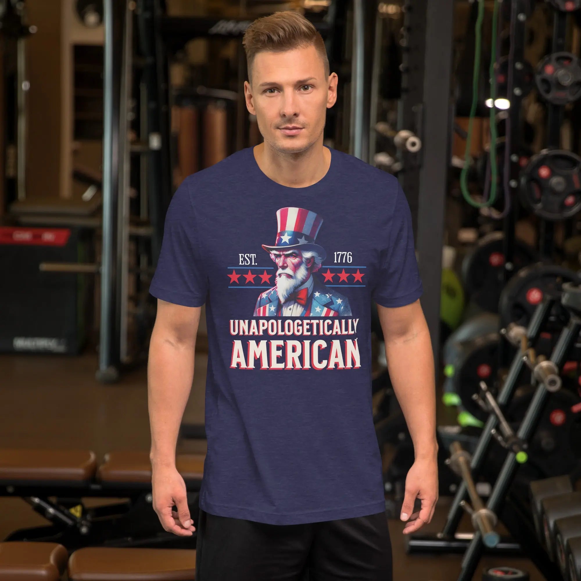 Man wearing a blue t-shirt with 'Unapologetically American' text and graphics in a gym setting