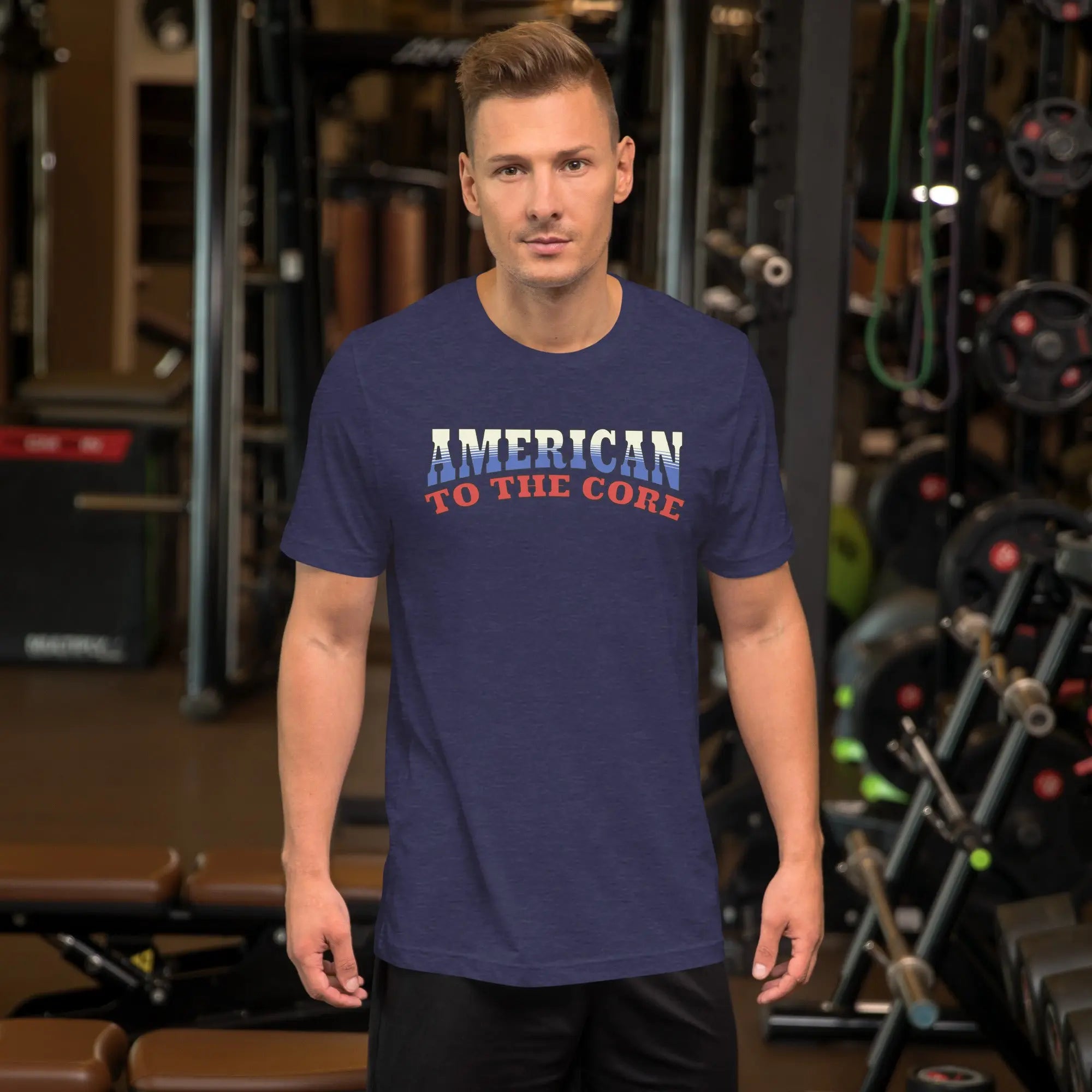 A man wearing a midnight navy patriotic t-shirt with "America to the core" text in red, white and blue