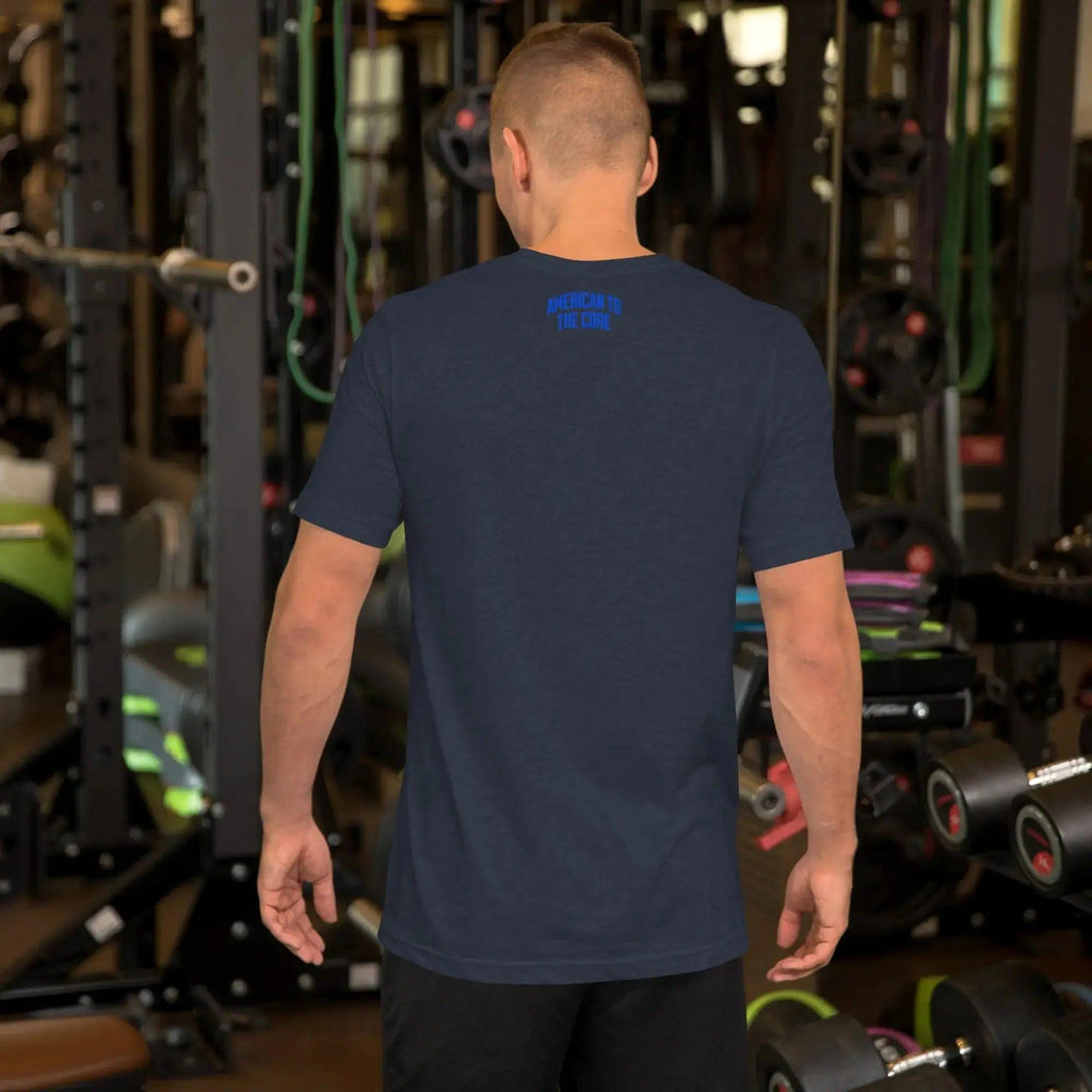 Back of a man wearing a heather navy patriotic t-shirt with the text "American To The Core."