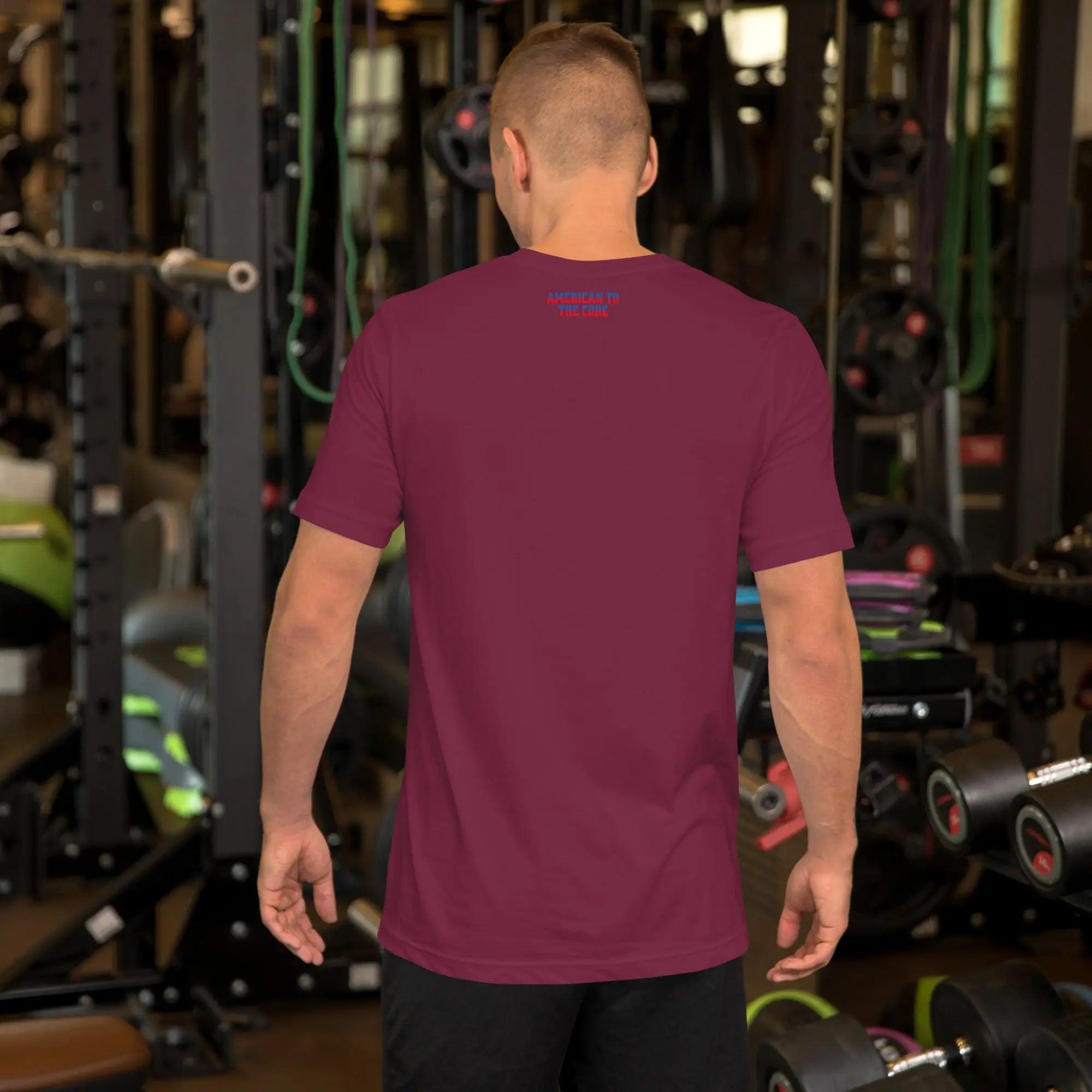 Back of a man wearing a maroon patriotic men's T-shirt with the text "American To The Core" in red and blue. 