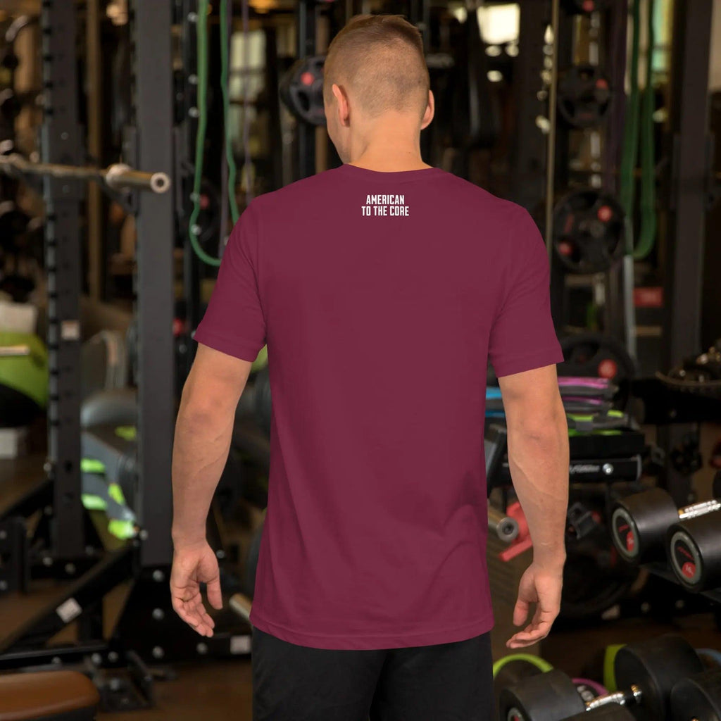 Back of a man wearing a maroon patriotic t-shirt with the text "American To The Core."