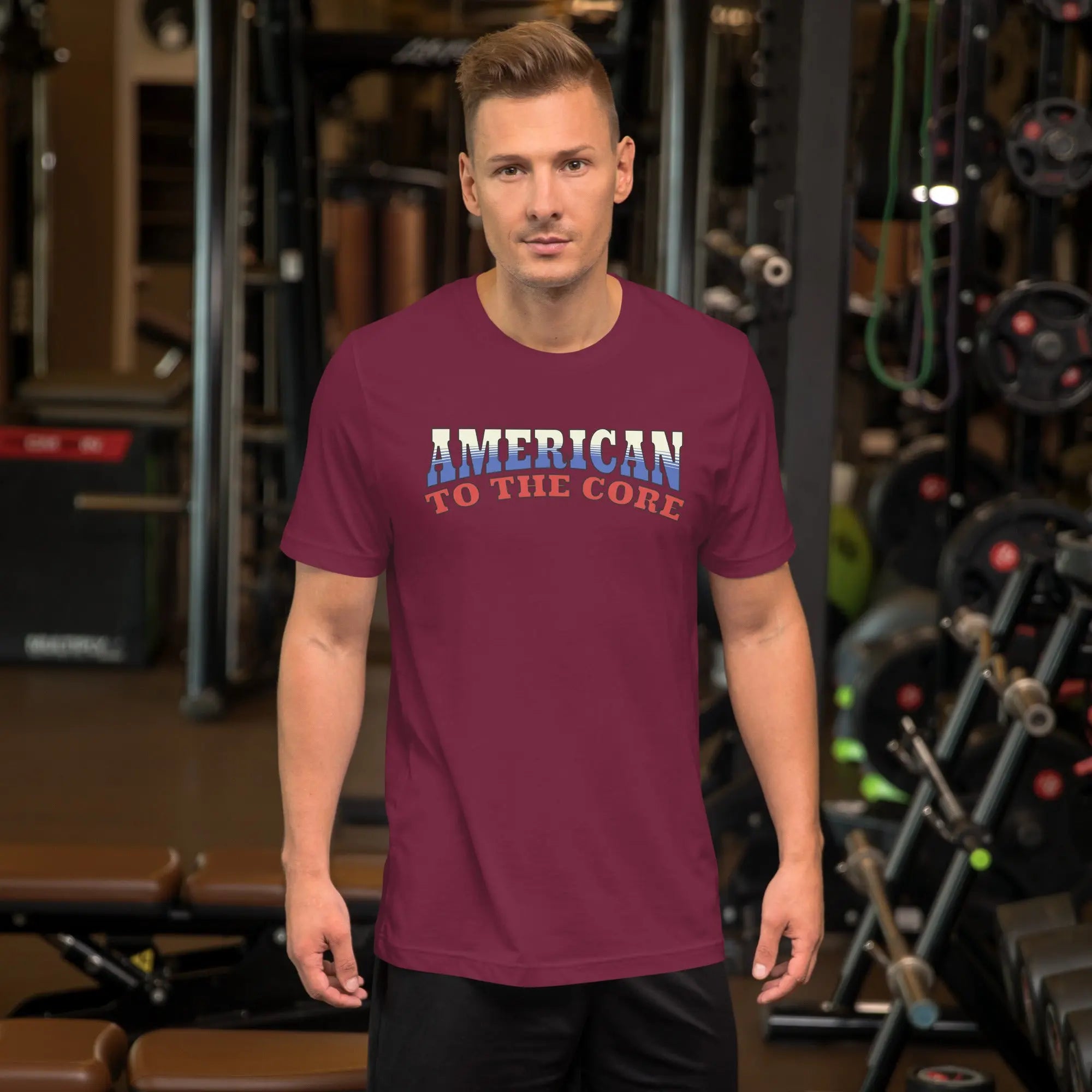 A man wearing a maroon patriotic t-shirt with "America to the core" text in red, white and blue