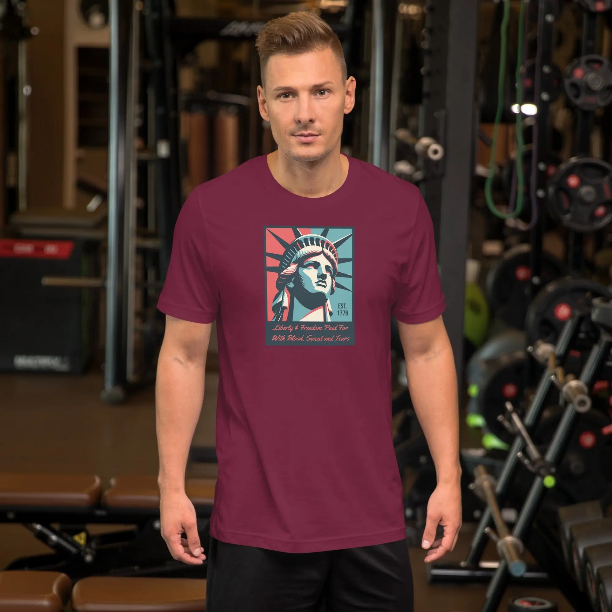 Front of man wearing a maroon patriotic t-shirt with a picture of the statue of liberty 