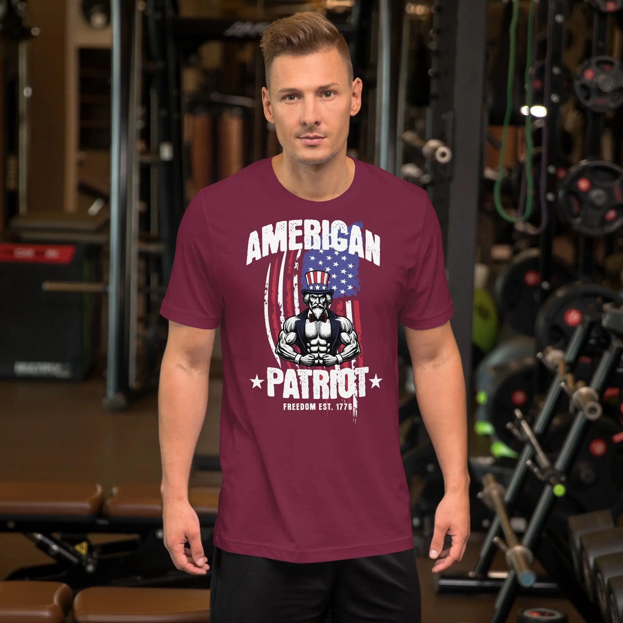 A man wearing a maroon patriotic t-shirt with a muscular Uncle Sam with "American Patriot" text.