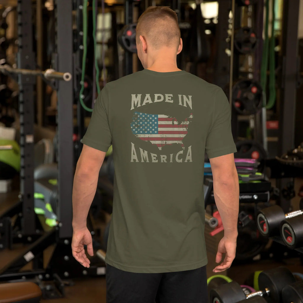 man wearing a military green patriotic t-shirt with "made in america" text. A silhouette of america with the american flag in it. 