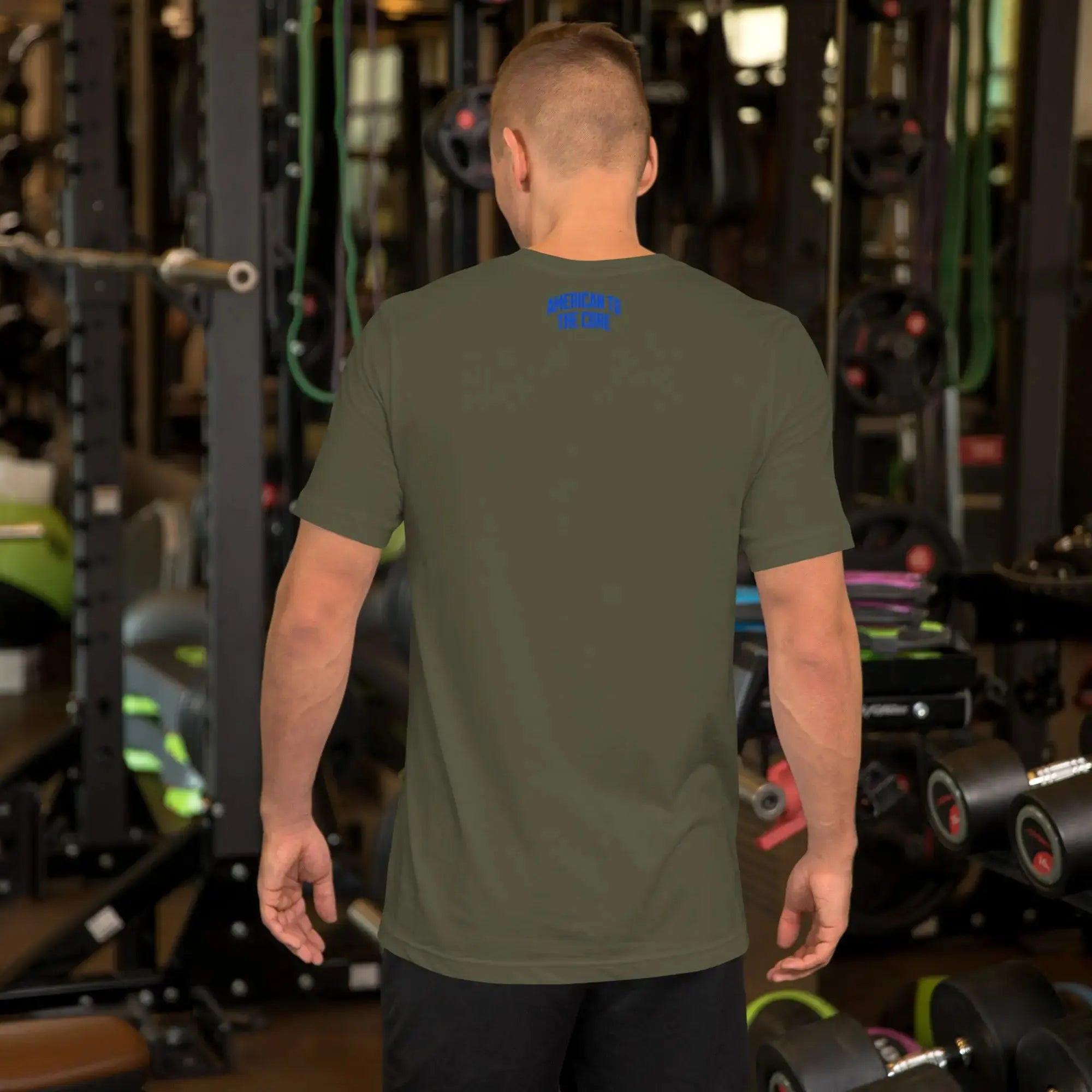 Back of a man wearing a military green patriotic t-shirt with the text "American To The Core."