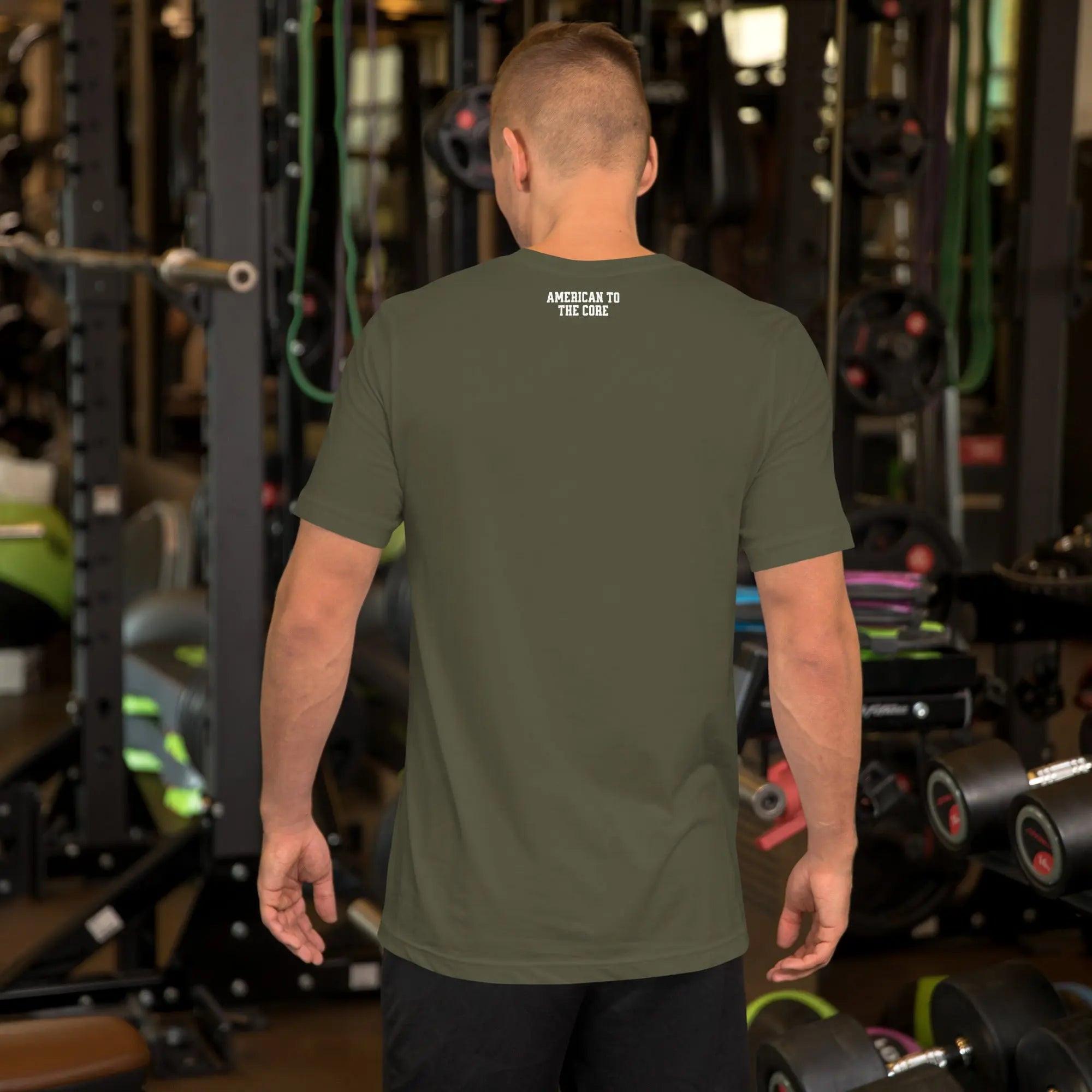 Back of a man wearing a military green patriotic t-shirt with the text "American To The Core."
