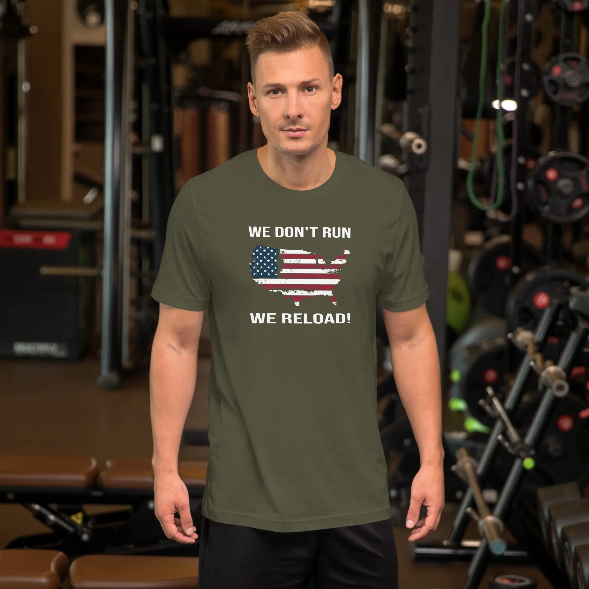 man wearing a military green patriotic t-shirt with "We don't run, we reload" text.